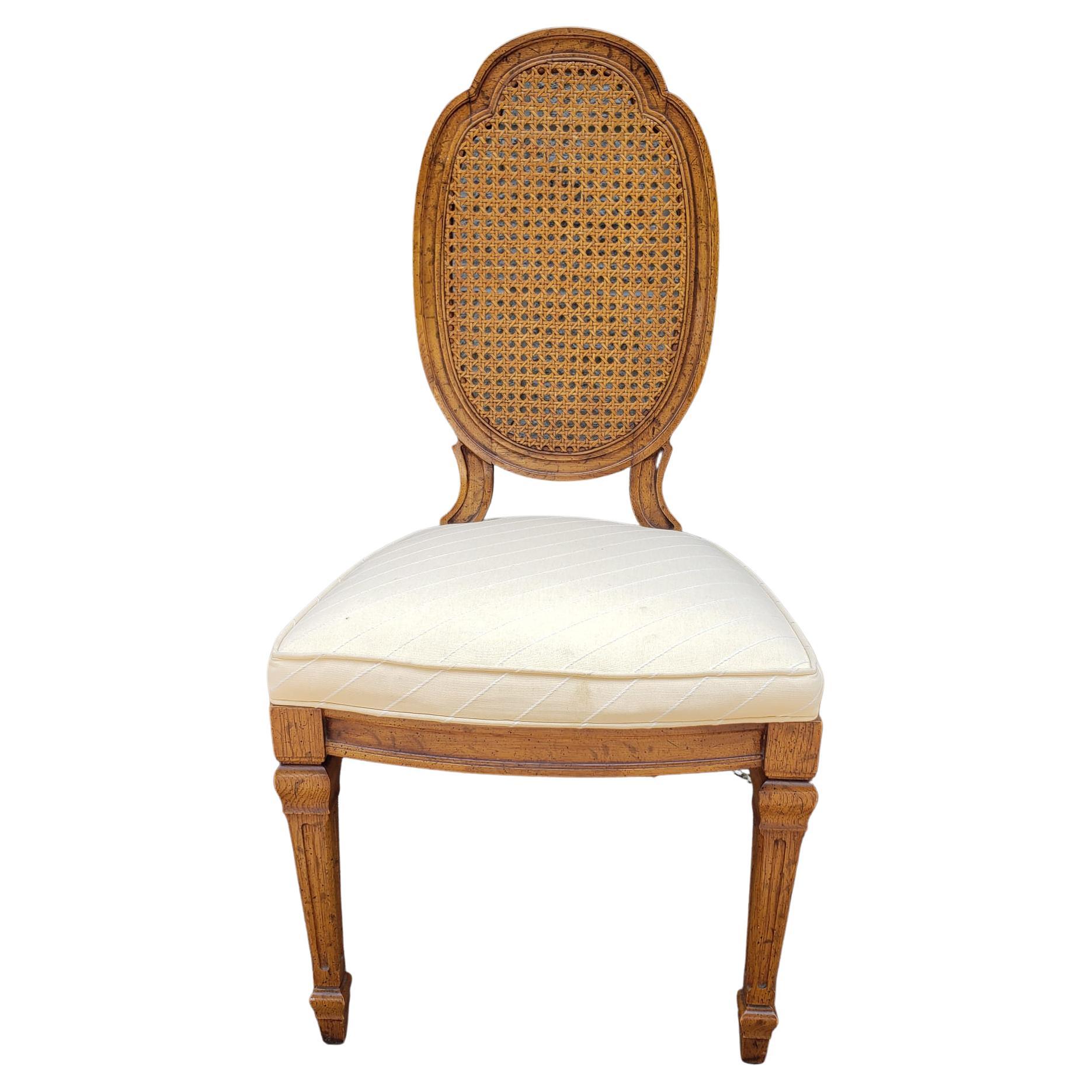 A Mid-Century French Country Walnut , Cane and Upholstered Seat side chair in very good vintage condition. 
Measures 19