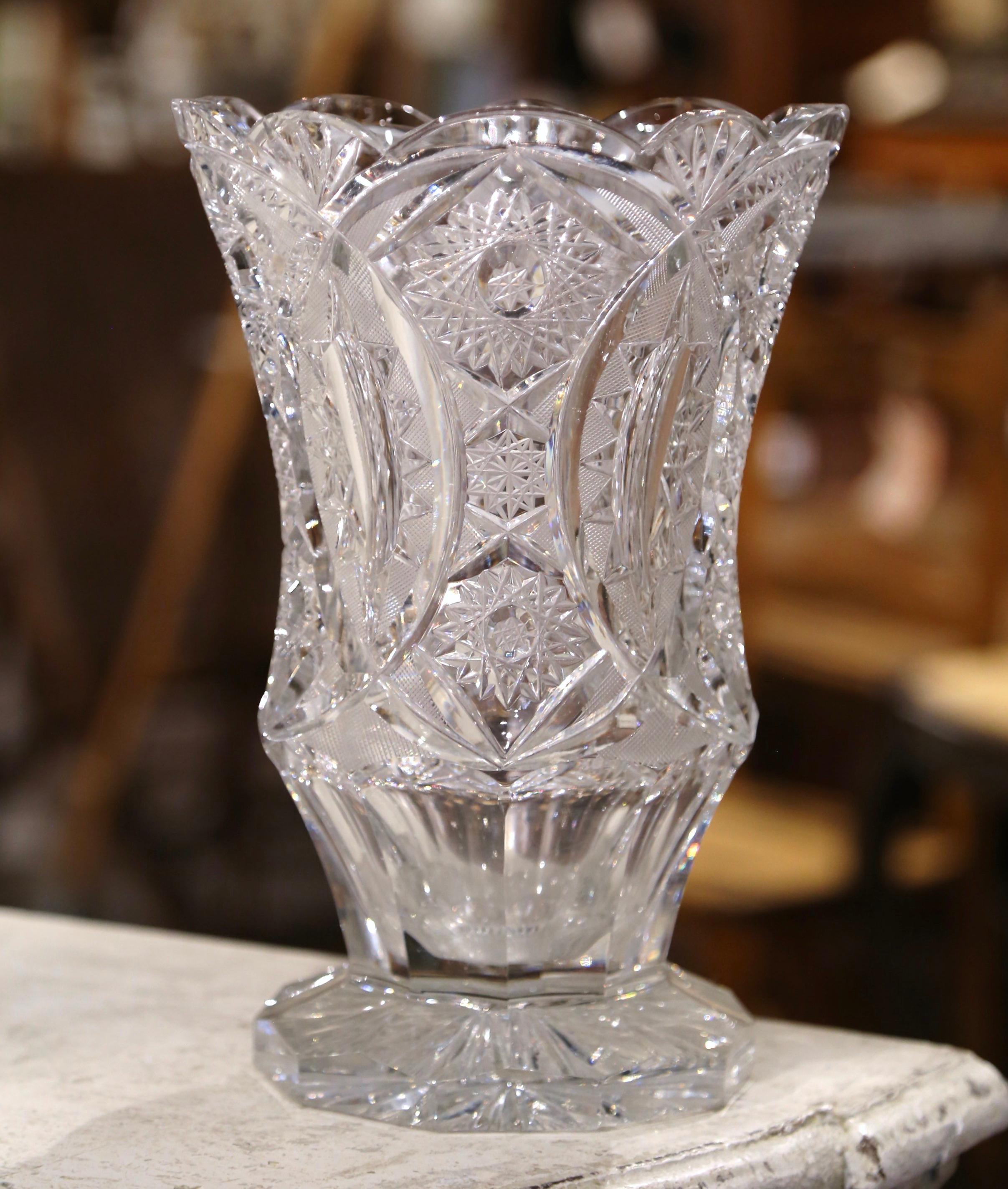 Decorate a side table or enfilade with this elegant antique vase. Crafted in France circa 1960, the tall neoclassical vase sits on a octagonal base and embellished with a wide mouth at the top. The Classic, cut crystal vase is decorated with a
