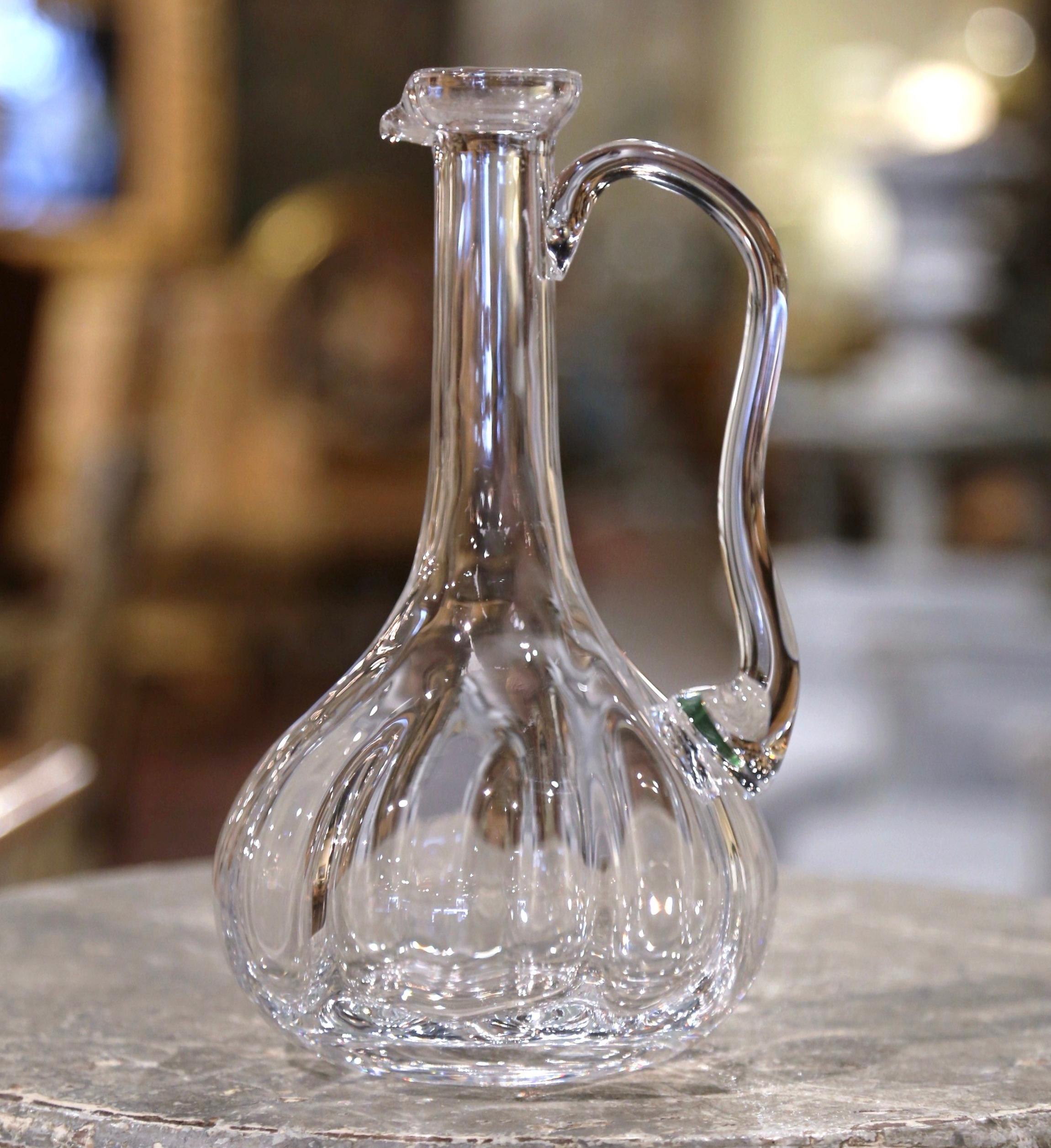 Let your red Bordeaux or Cabernet Sauvignon breeze in this elegant vintage wine carafe! Crafted in France circa 1960, the cut glass wine pitcher has the ideal shape to decant a bottle of red wine, wide at the base, with a long neck dressed with