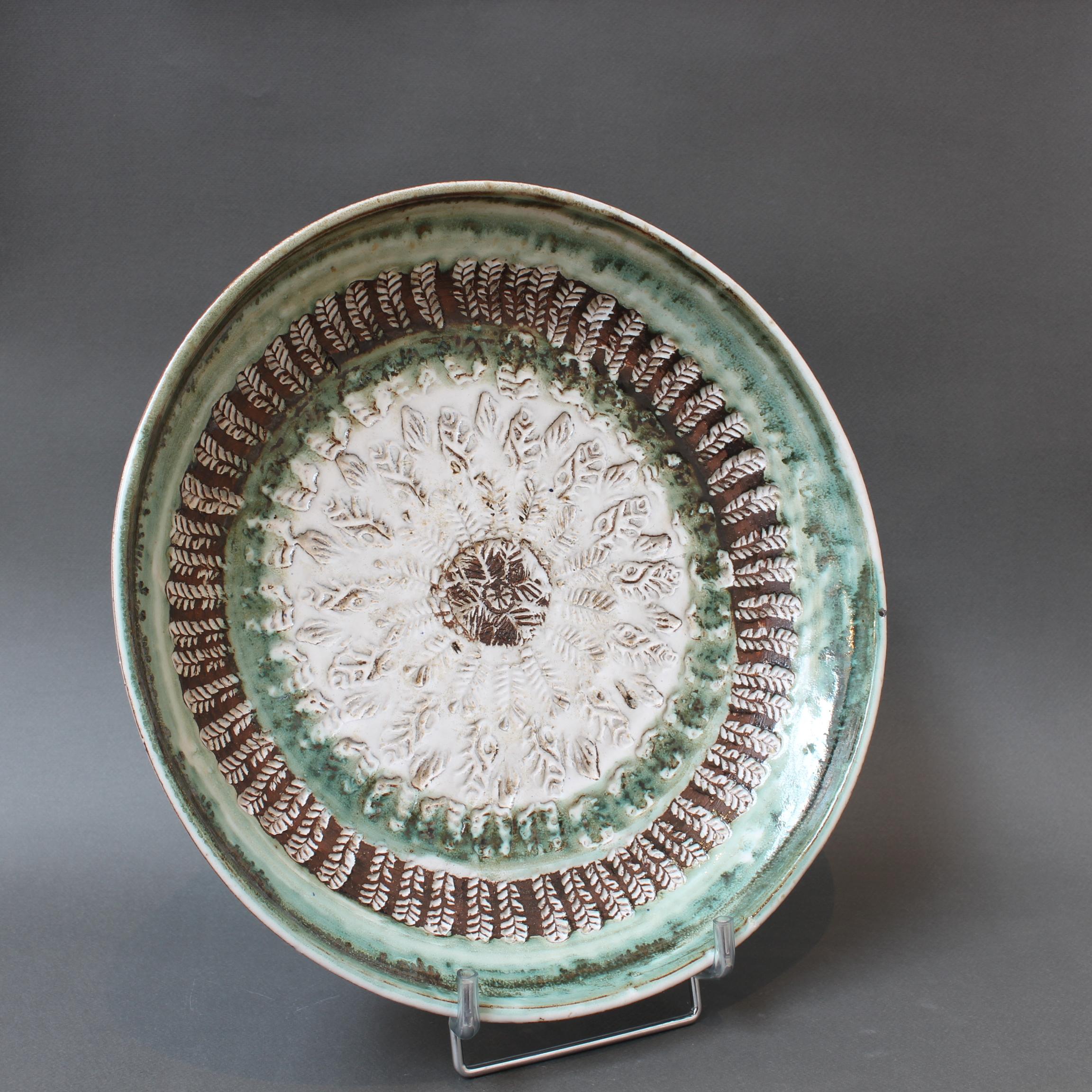 Mid-century decorative platter (circa 1960s) by Albert Thiry. A large sunflower springs to mind looking at the platter. Both visually stunning and tactile at the same time, the deeply engraved motif with its various patterns bring the whole