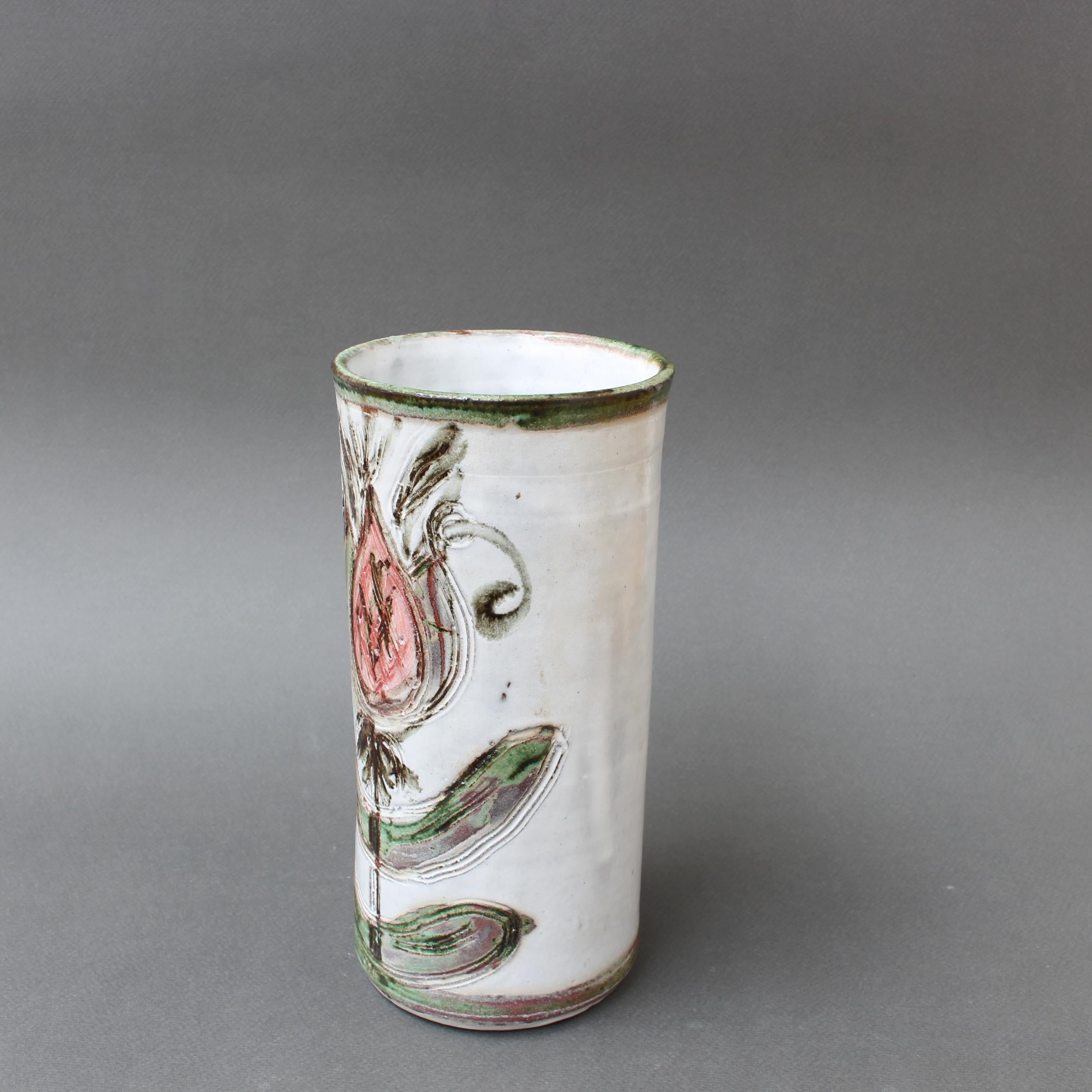 Mid-century decorative vase by French ceramicist, Albert Thiry (circa 1960s). A gentle, creamy-white glaze encompasses the exterior of the vase topped at the lip by a grassy green with touches of brown. Covering the piece you will find a stunning,