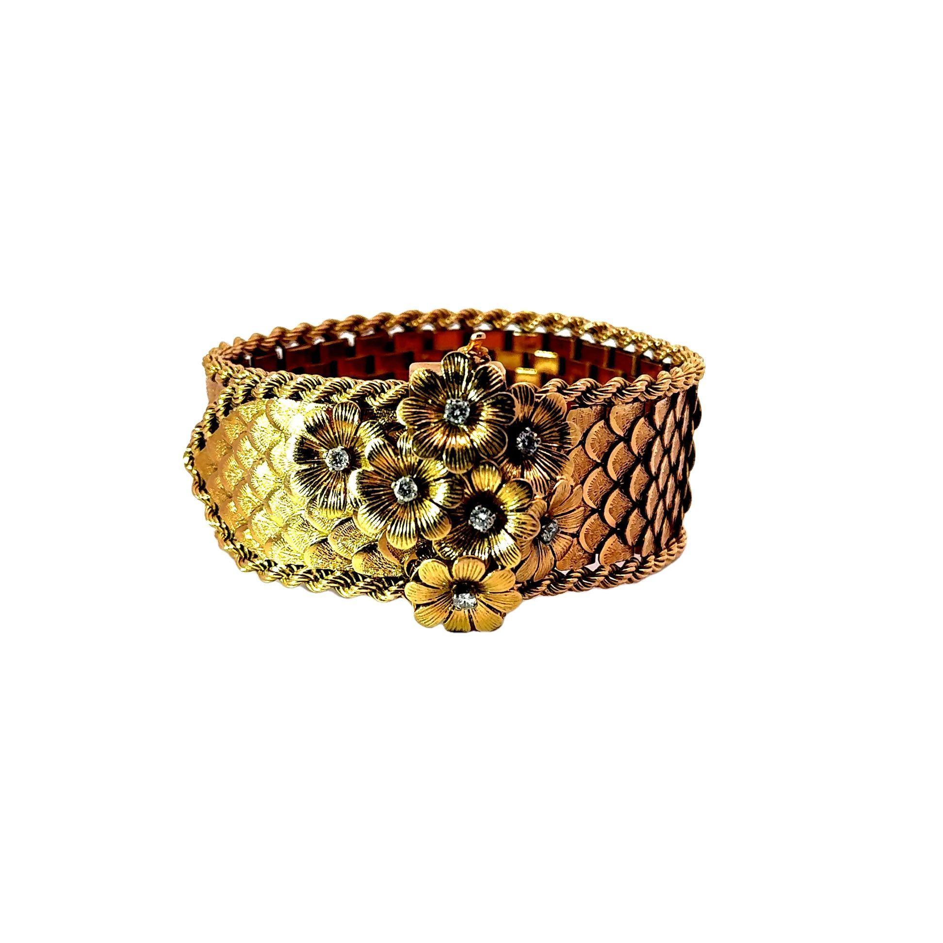 A marvelous mid-century treasure from France! This exquisite bracelet from the 1950’s showcases a woven design in 18k yellow gold, depicting a detailed flower bouquet. The piece is adorned with round white diamonds, totaling 0.50 carats, adding a