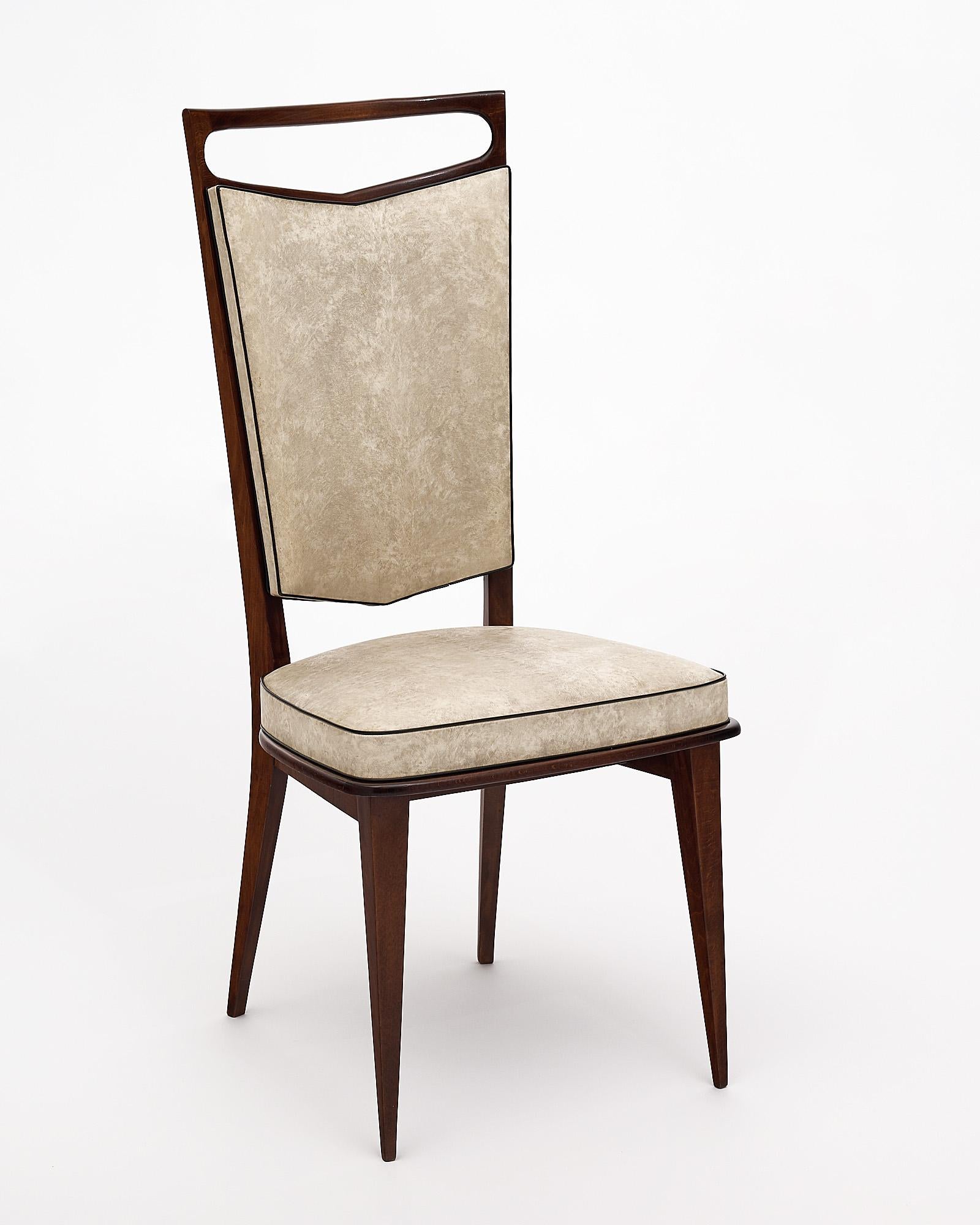 Set of six dining chairs, French, made of rosewood and finishing in a lustrous French polish. They have very strong frames and are comfortable. The chairs are upholstered in the original skay, in fair condition.