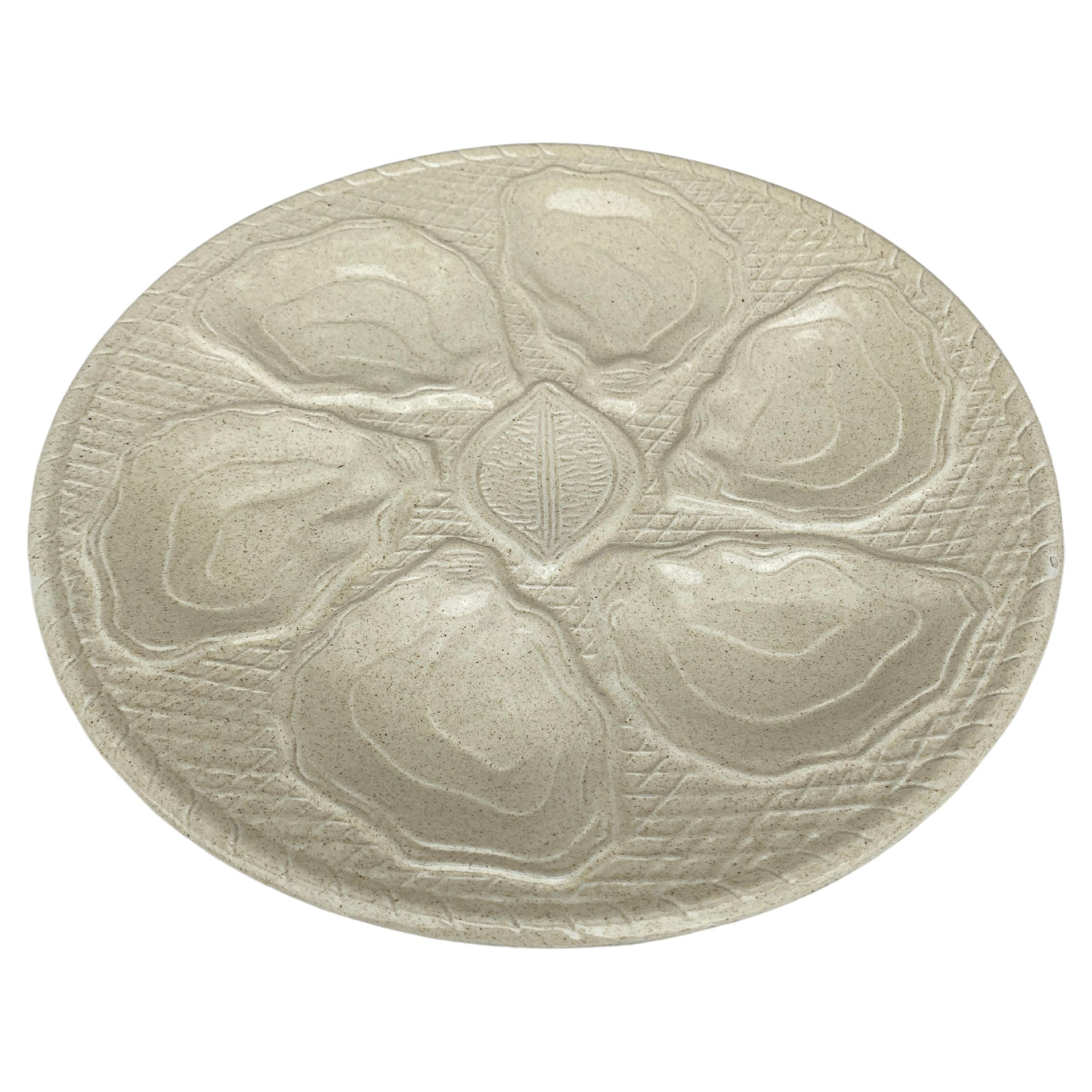 Mid-Century French Ecru Majolica Oyster Plate .
Lemon on the center.