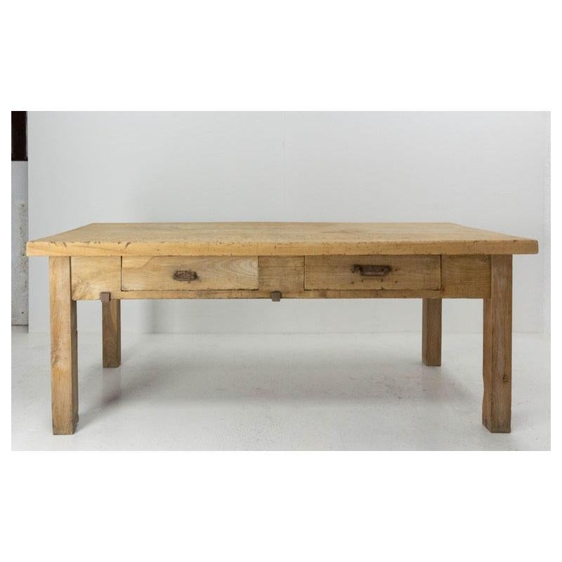 French work table from a restaurant, circa 1950
Meuble de Metier elm
Two drawers
Height between the floor and the drawers: 25.60 in. (65 cm)
Good antique condition with characterful marks of use. 
Crossing height 23.22 in
Shipping:
P 99 x L