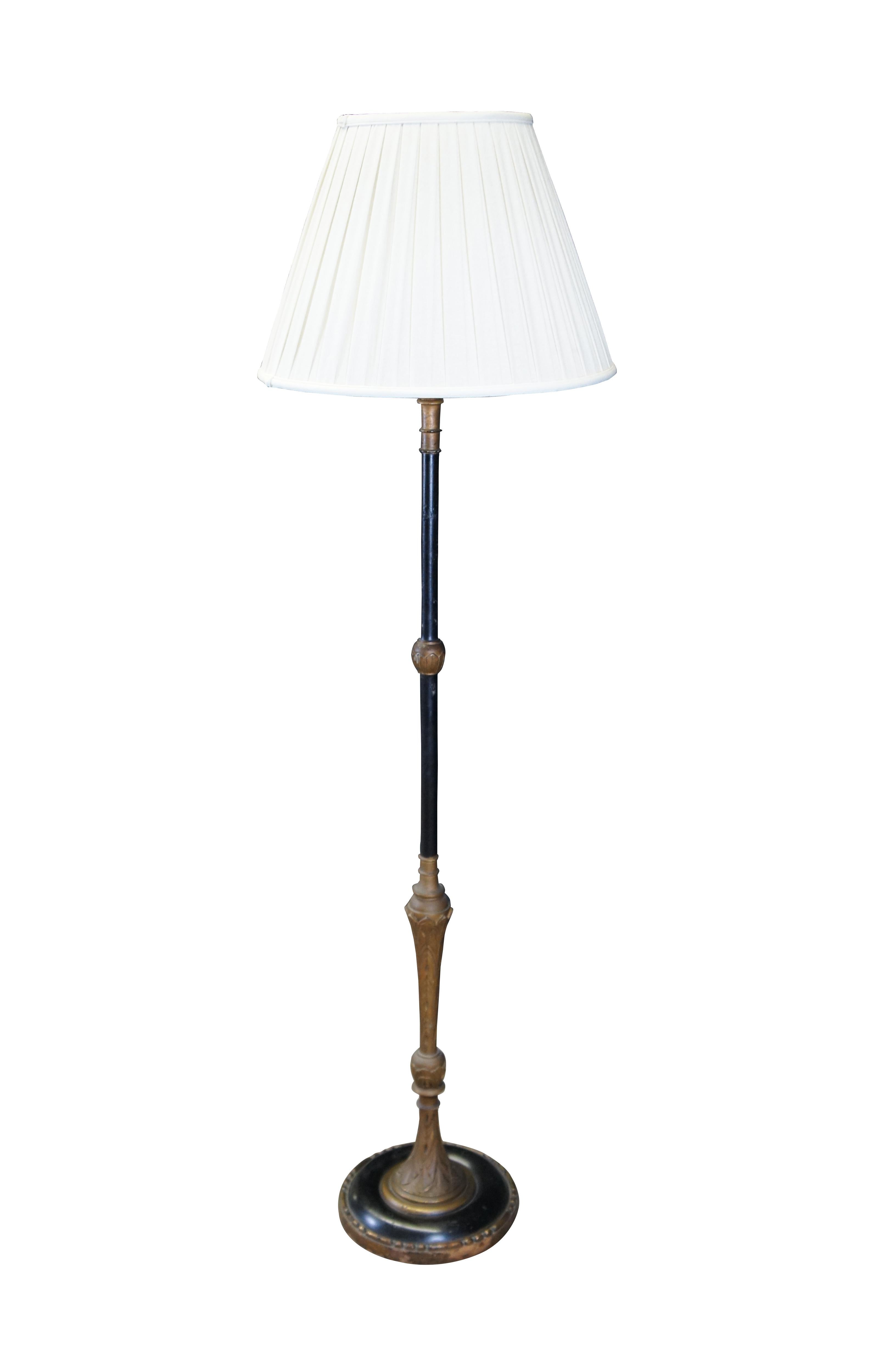Mid century French Empire style library / reading floor lamp.  Made of ebonized and gilt wood featuring acanthus design with two lights, long pull chains and tapered shade.

Dimensions:
24