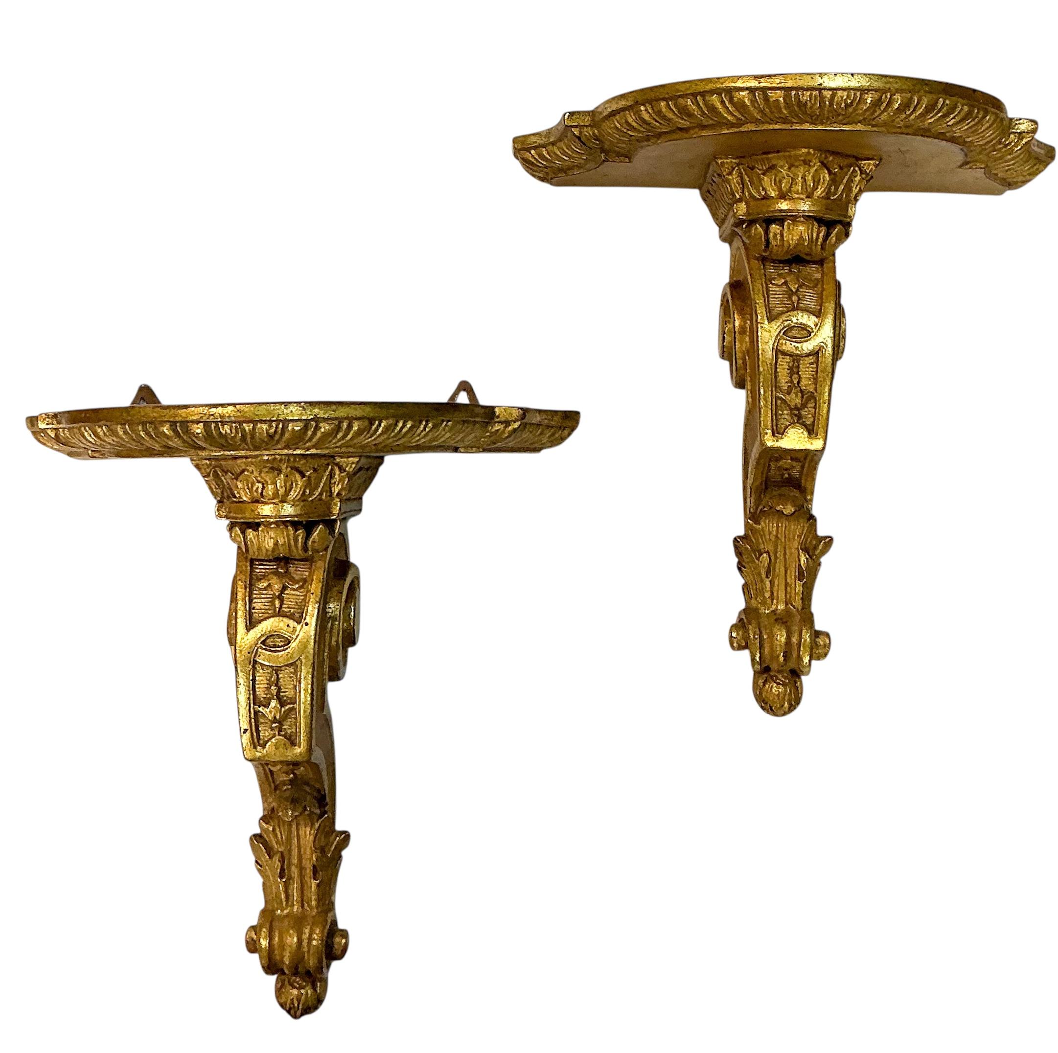 This is a pair of French Empire revival terracotta wall brackets with lovely water gilt finish. They date to the middle of the 20th century. They are unmarked and in very good condition.