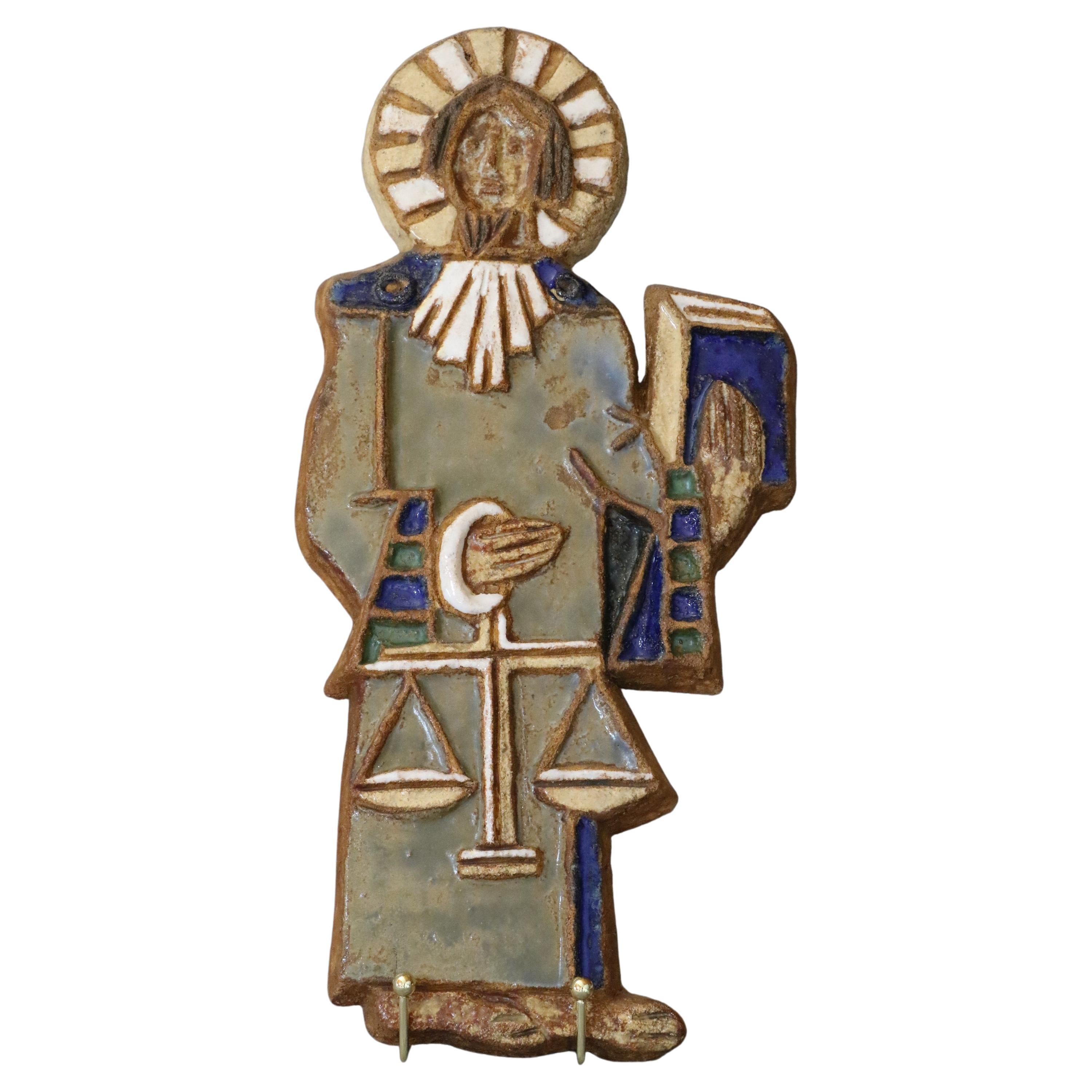 Les Argonautes - Mid-Century Modern French Ceramic, Saint Michael - 1960s, Signed

Glazed ceramic plate representing St Michel. It is a decorative work of very beautiful size. There is a nice contrast between the liveliness of the colors of the
