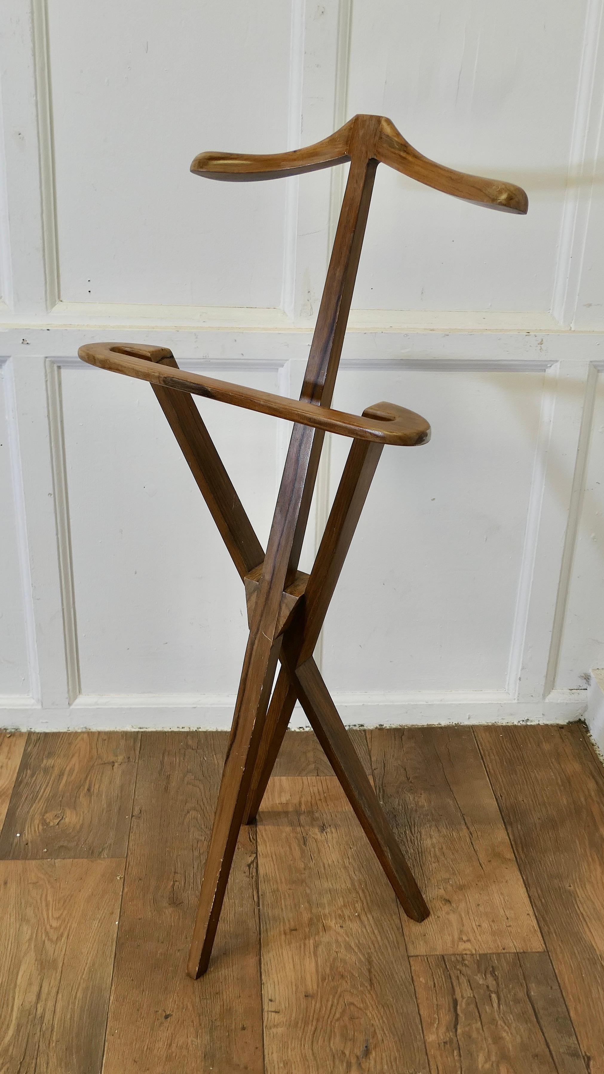 Mid Century French Gentleman’s Floor Standing Suit Hanger or Valet 


A very stylish piece and it can be folded flat when not in use, the clothes stand or Valet is made in teak it has a 3 footed base, it has a coat hanger at the top and a wide rail