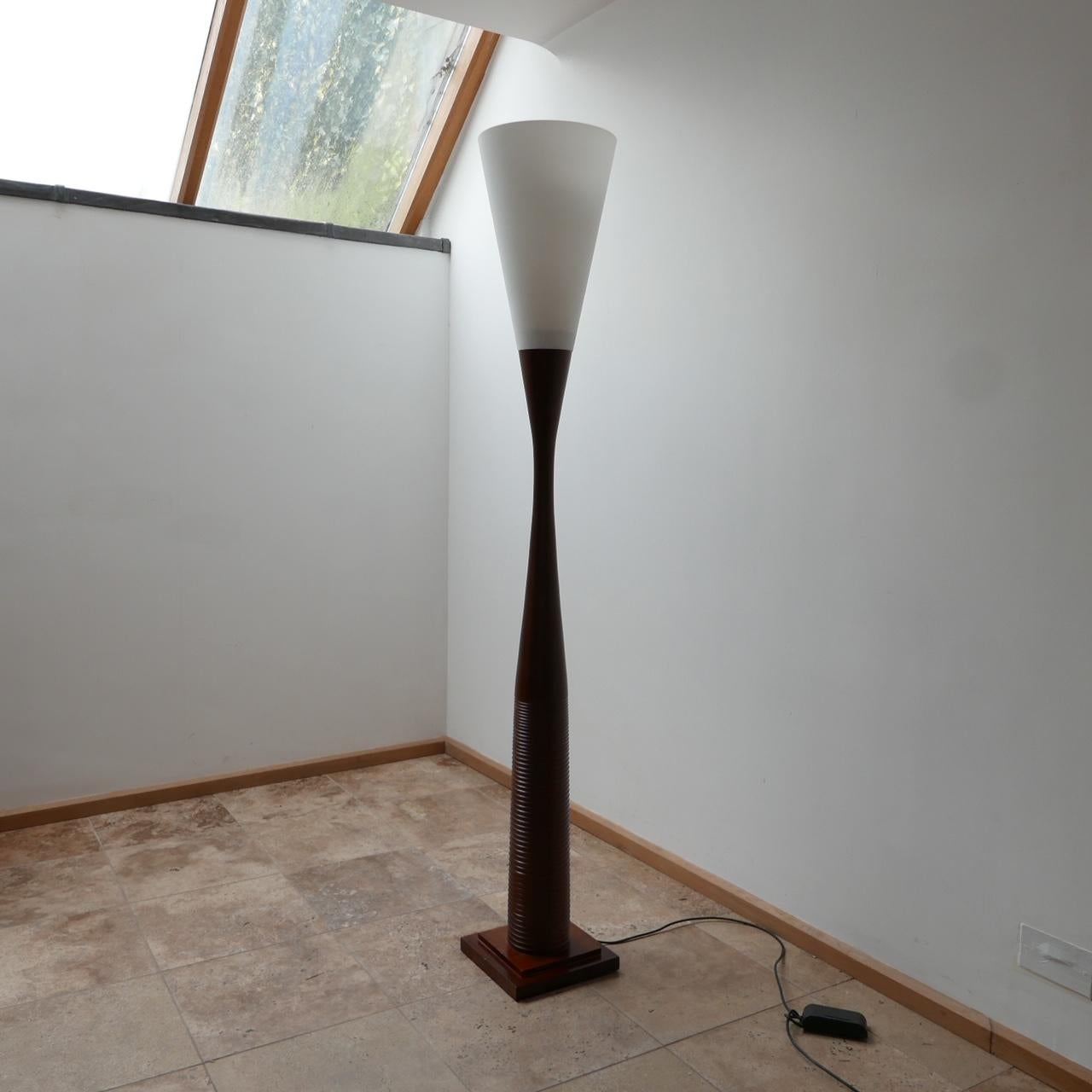 A stylish late 20th century floor lamp. 

France, c1980s. 

Large glass shade, over a stylish wooden shaped stem. 

Since re-wired and PAT tested. 

Dimensions: 185 H x 29 D x 29 W in cm.
 