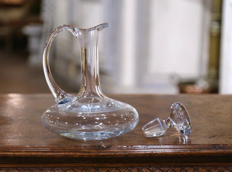 https://a.1stdibscdn.com/mid-century-french-glass-wine-carafe-decanter-with-stopper-and-handle-for-sale-picture-5/f_9512/f_272907521645544668440/221_53_4_master.jpeg?width=768