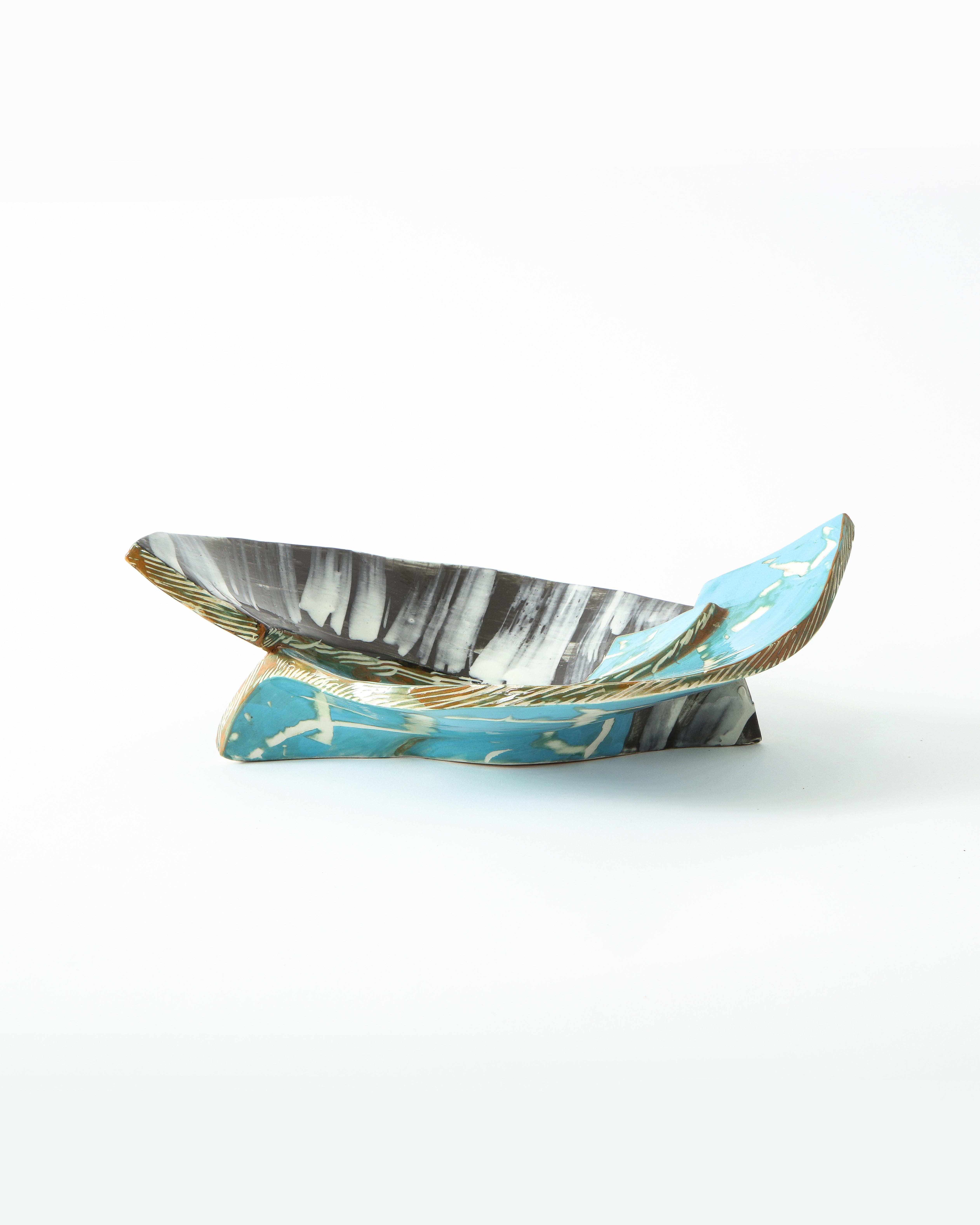 Vide poche with two vibrant turquoise curved forms in contrast with an opposing a black curve detailed with thick white brushstrokes. This catch-all is sophisticated on its own or could be used as a functional piece. Artist signature