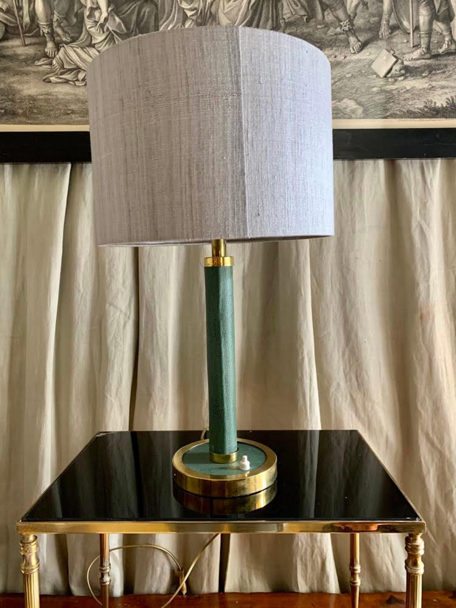 Midcentury table lamp, Adnet style, in green leather and gold brass, new wiring, light gray silk lampshade.