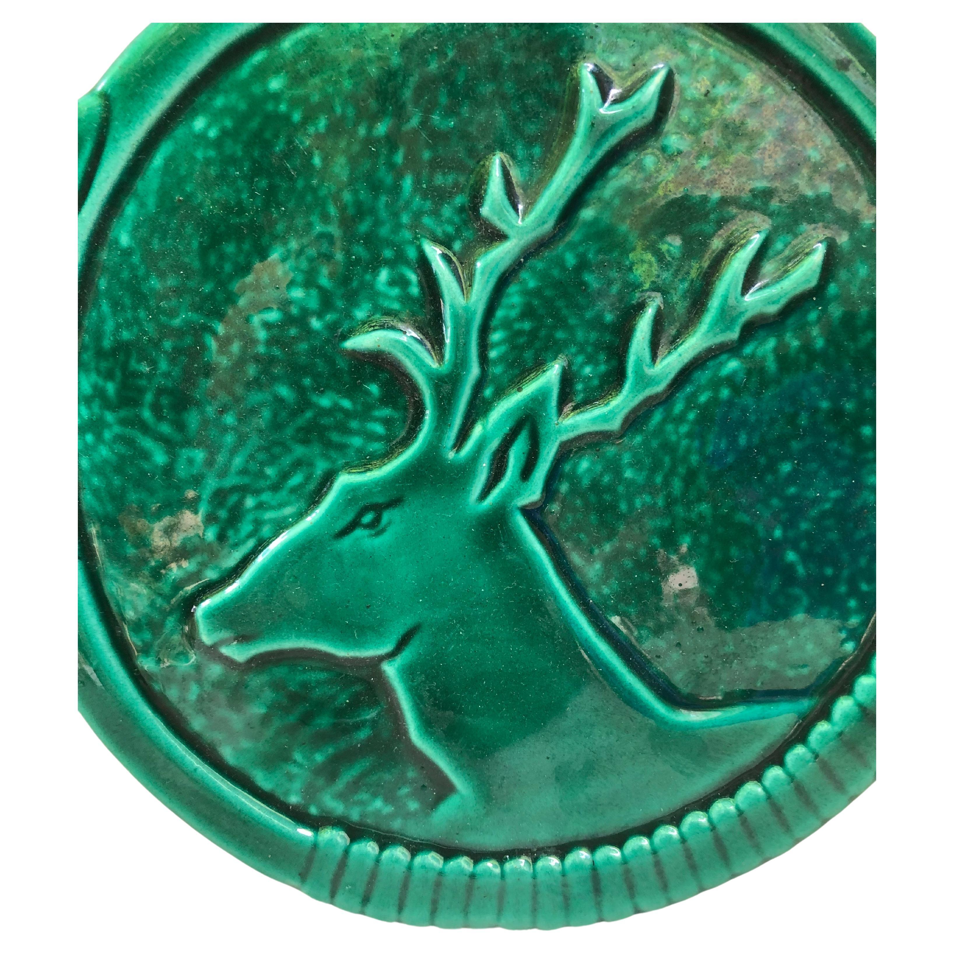 Mid-century French Green Majolica deer Trivet Vallauris.
Shaped as an hunting horn.