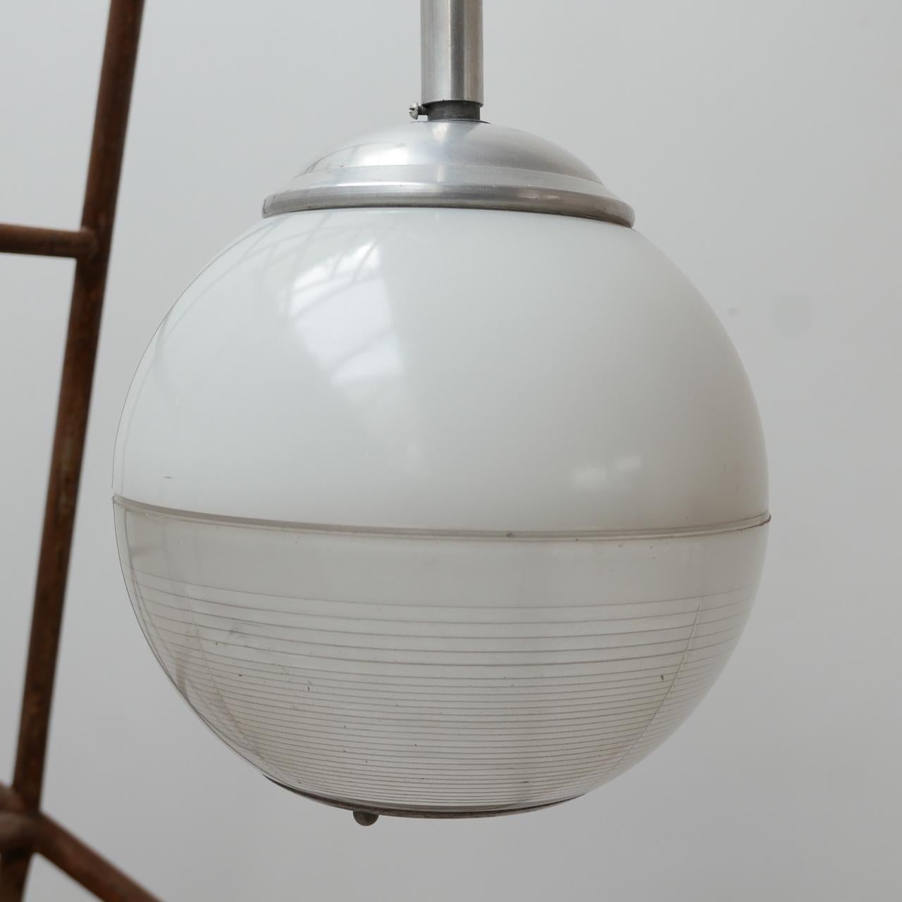 A mid-century French holophane two tone globe pendant light. 

Small nibbles to the edge of the glass of one side (see photos) priced accordingly. 

A good two tone coloured glass. 

France, c 1950s. 

Since re-wired and PAT tested. The stem