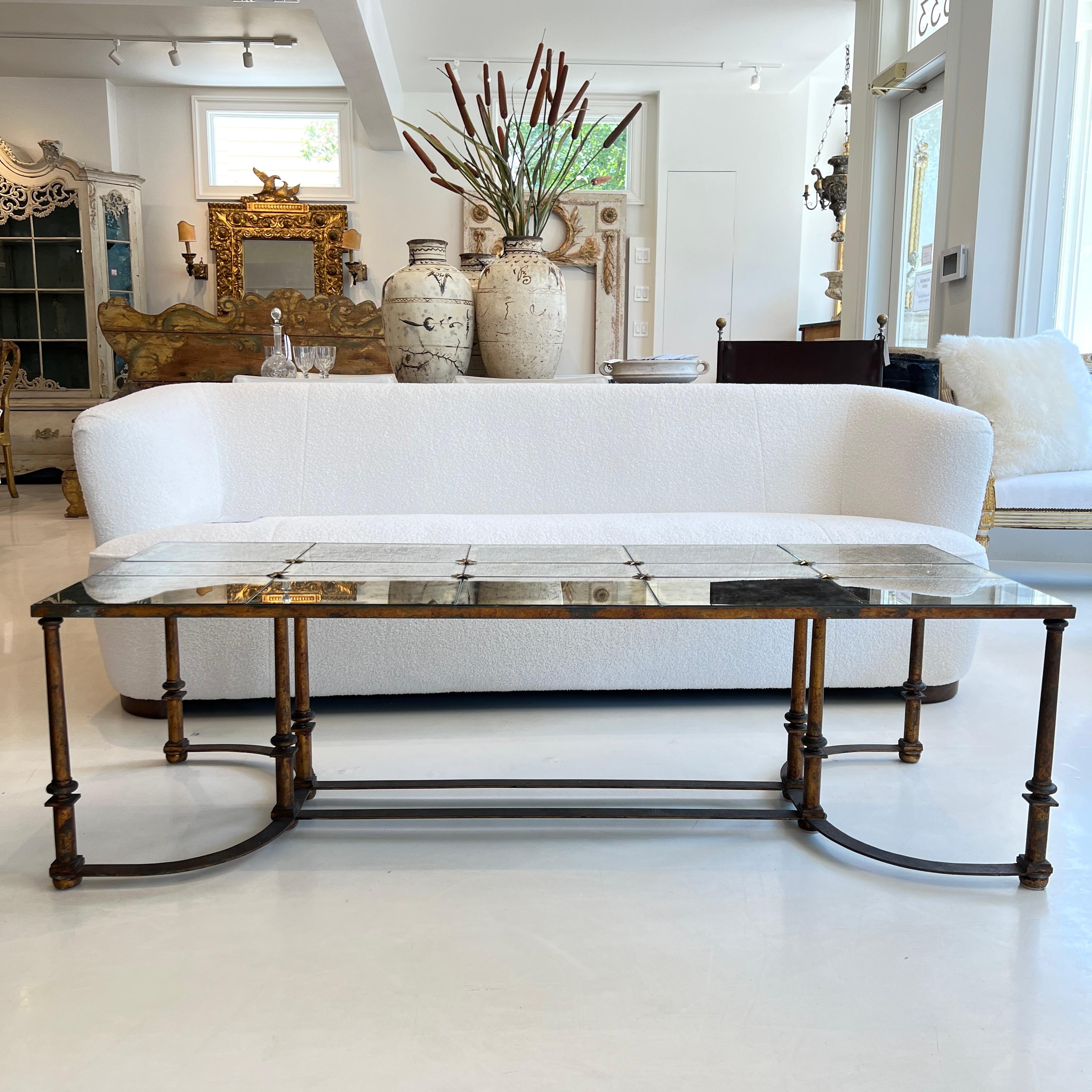 This Mid-Century floxed mirror coffee table features a sleek, low profile with a hand-applied floxed mirror surface that creates a soft, cloud-like shimmer—bringing subtle glamour and artistic texture to any modern interior.