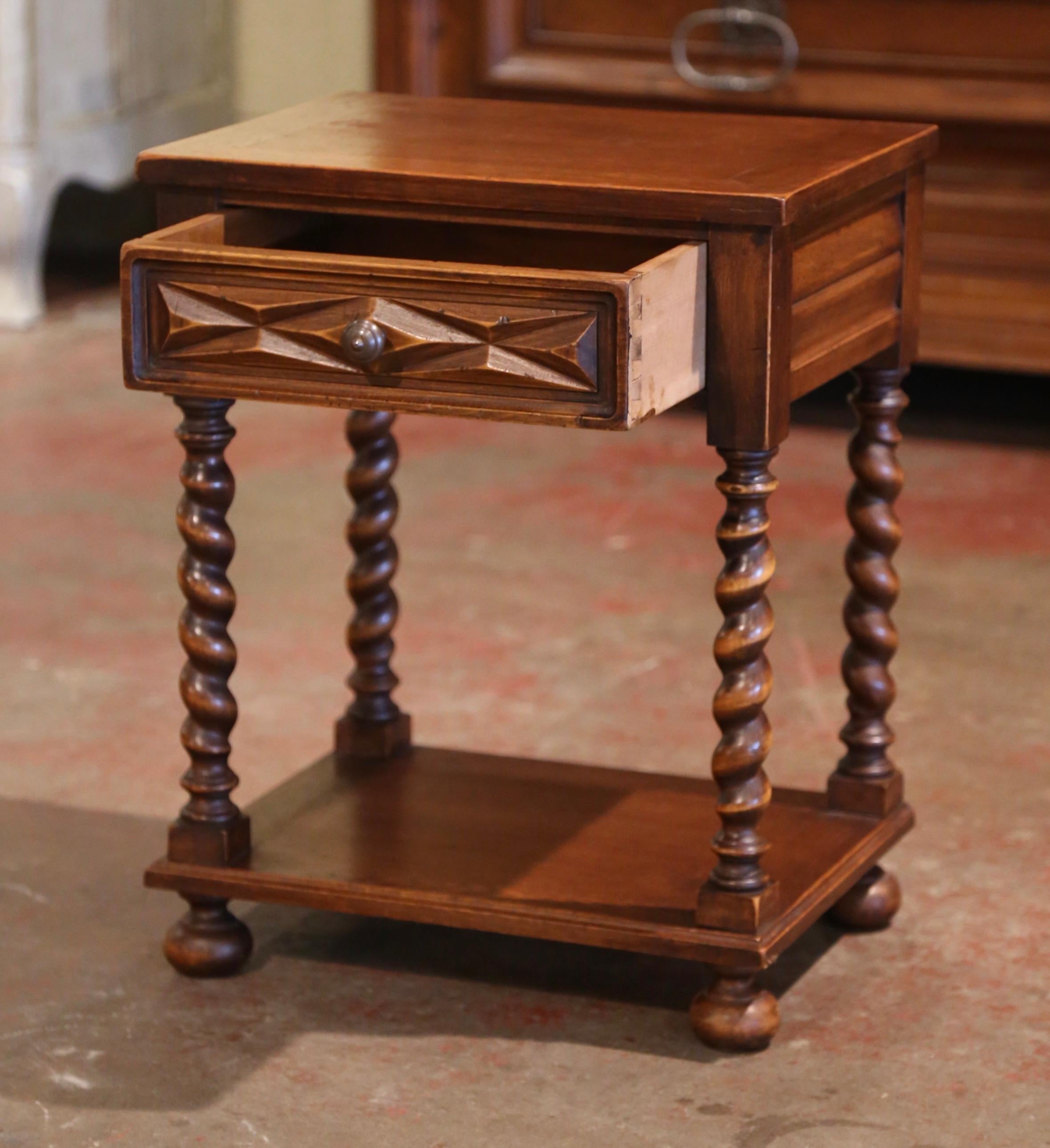 Incorporate extra, functional surface space into your living room with this elegant side table. Crafted in the south of France circa 1960 and rectangular in shape, the petite table stands on four hand carved, barley twist legs terminated with bun