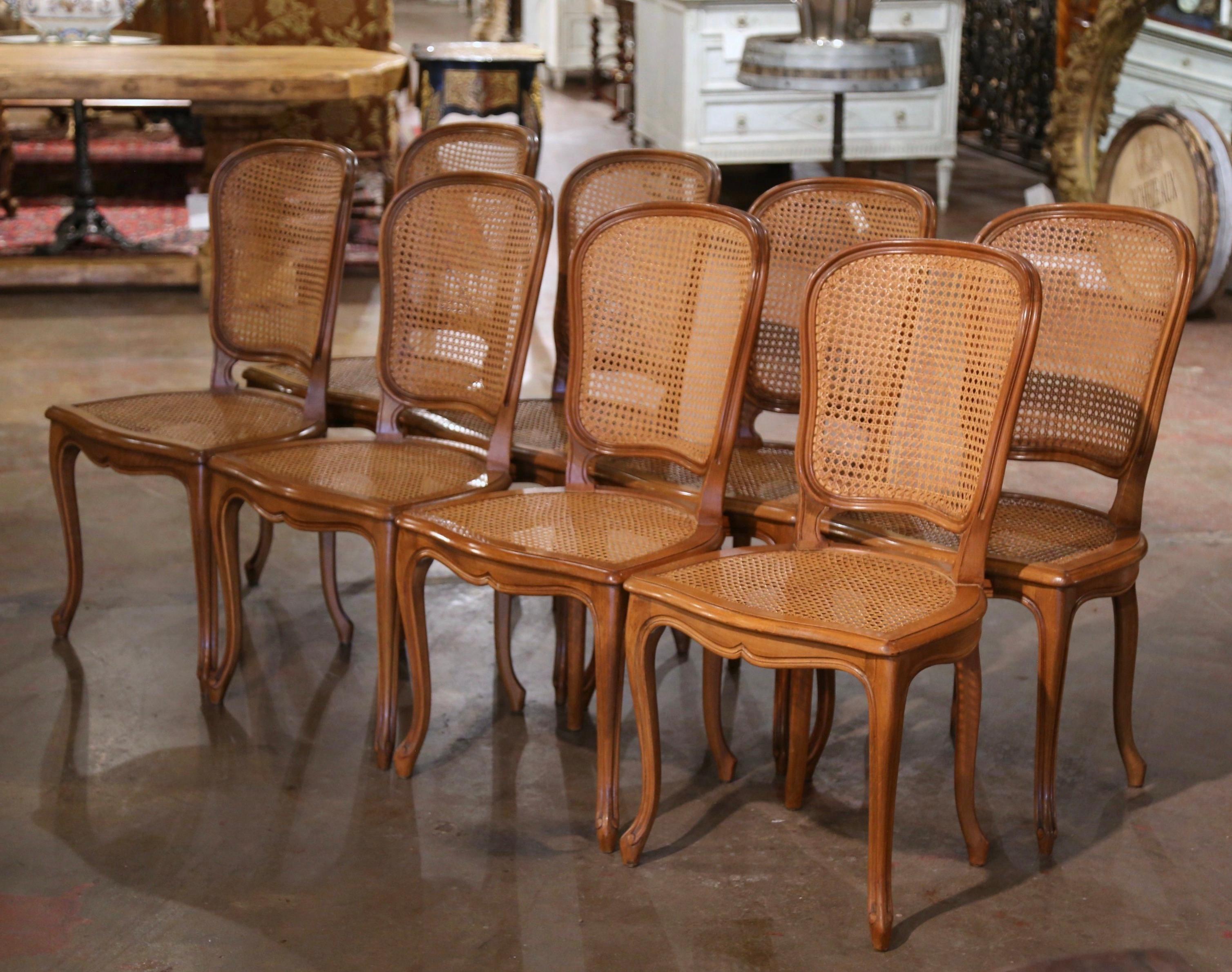 Decorate a dining table with this elegant suite of antique side chairs. Crafted in France circa 1970, and built of beech wood, each dining chair stands on cabriole legs ending with whorl feet over a scalloped apron. The chair features a rounded and