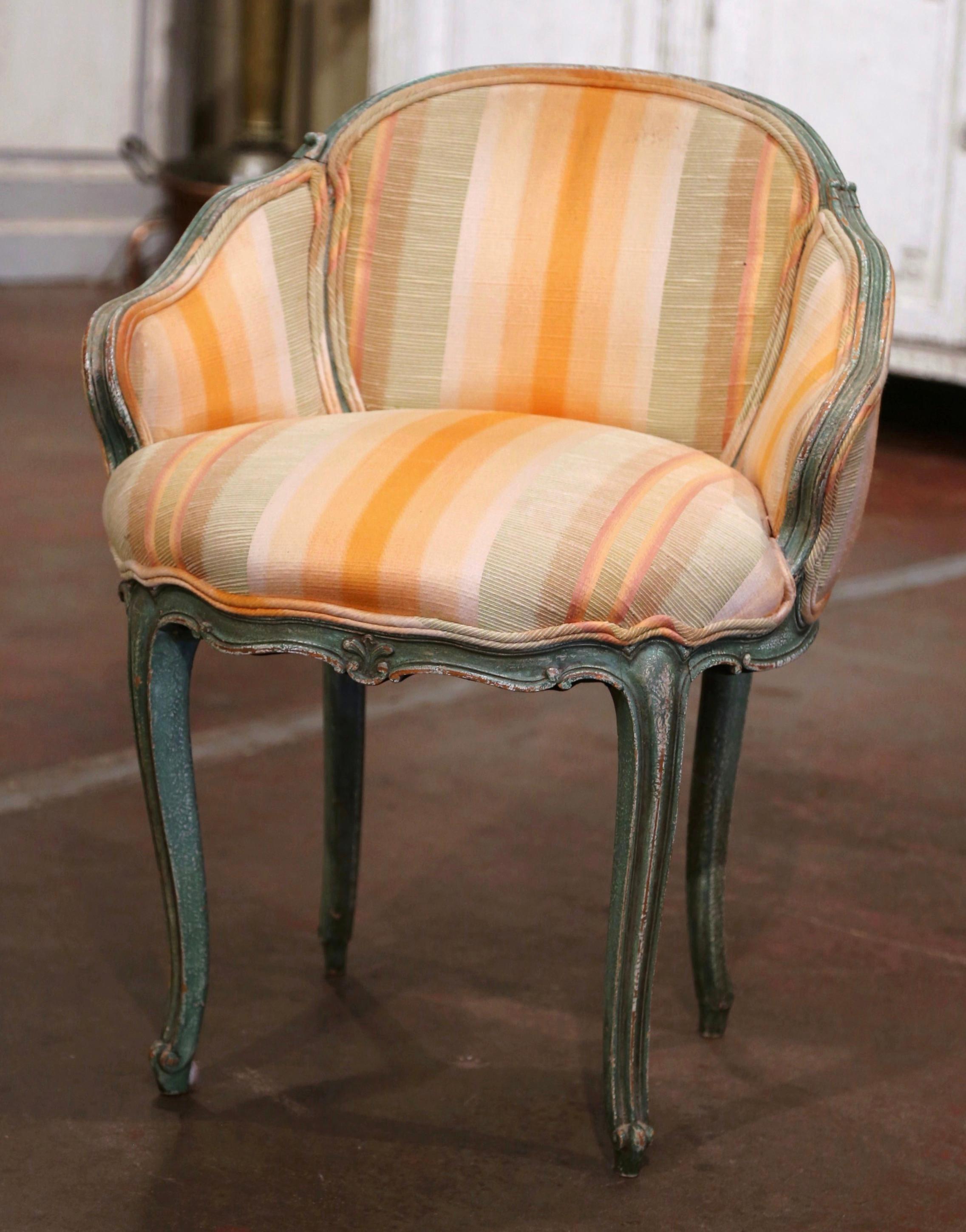 Decorate a master bathroom or bedroom with this elegant antique armchair; crafted in France circa 1920, the chair stands on cabriole legs over a curved apron. The chair is embellished with curved armrests which lead seamlessly up around the back of