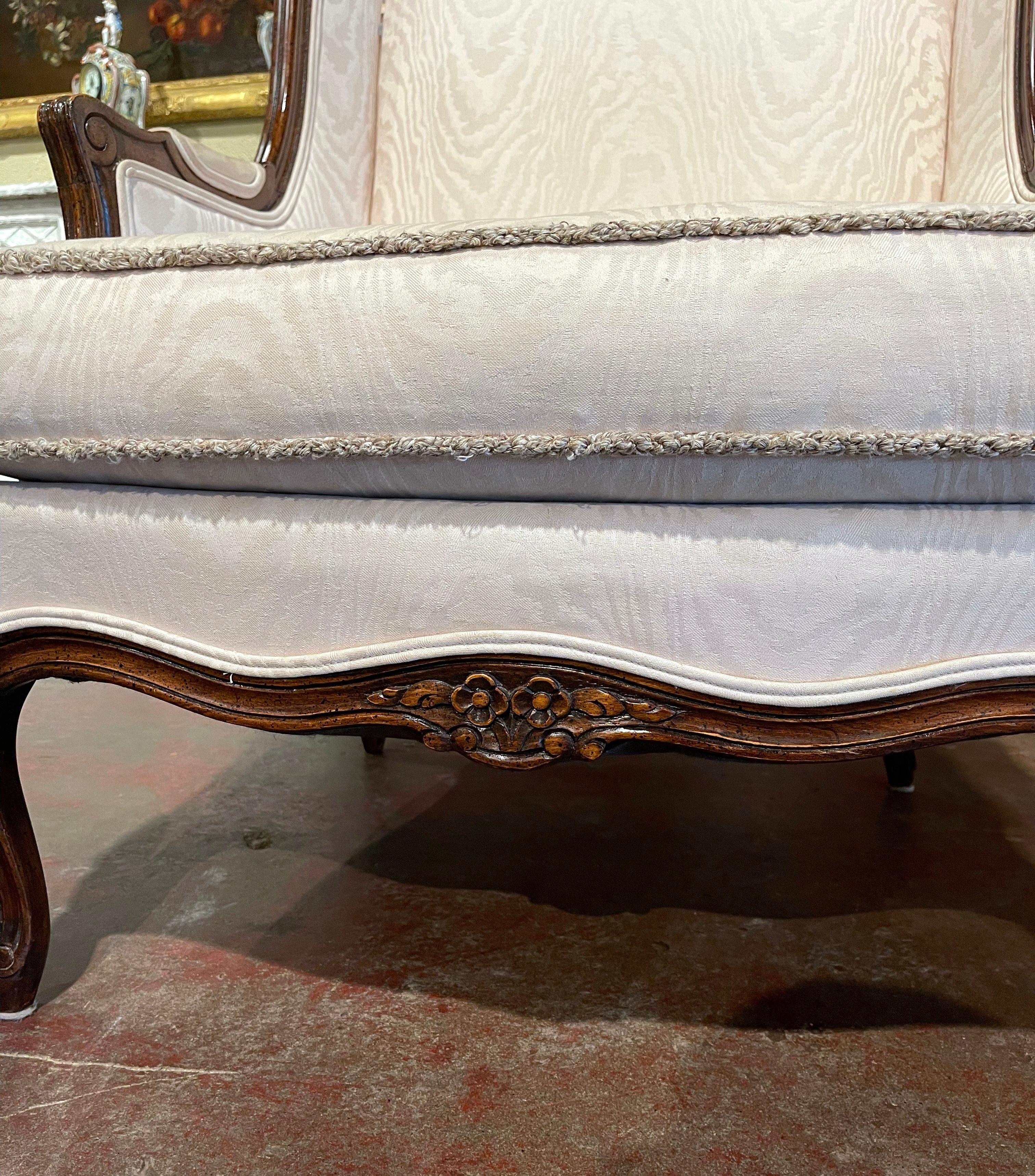 This beautiful antique fruitwood two-piece chaise, was crafted in Provence, circa 1950. The set includes a 