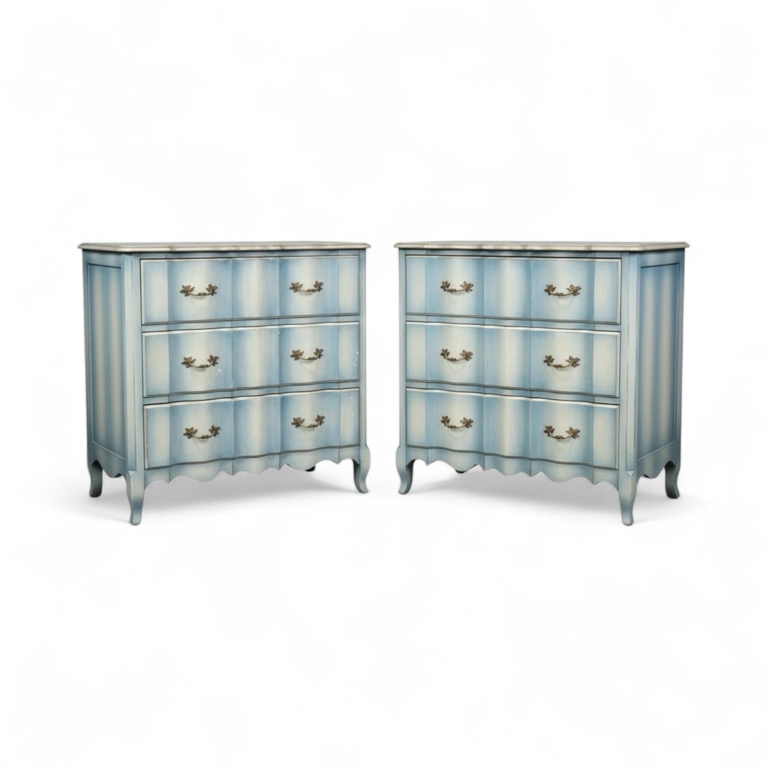 I love these! This is a pair of 1960s/ 70s French Louis XV style chests with a custom finish….a blue ombre with silver gilt trim. They have dovetail construction and are in very good condition.