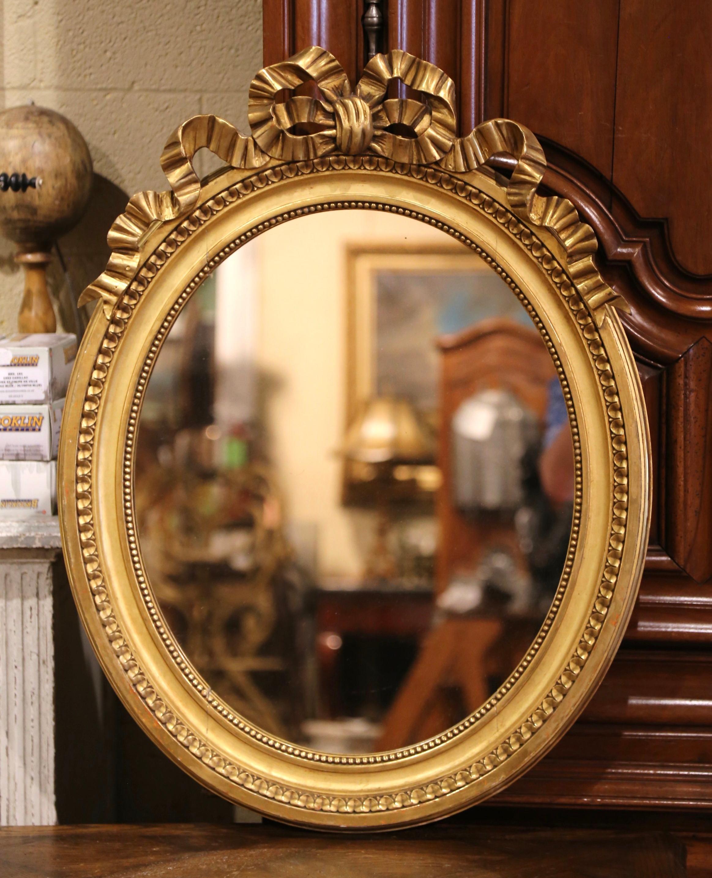 Mid-Century French Louis XVI Carved Giltwood Oval Wall Mirror In Excellent Condition In Dallas, TX