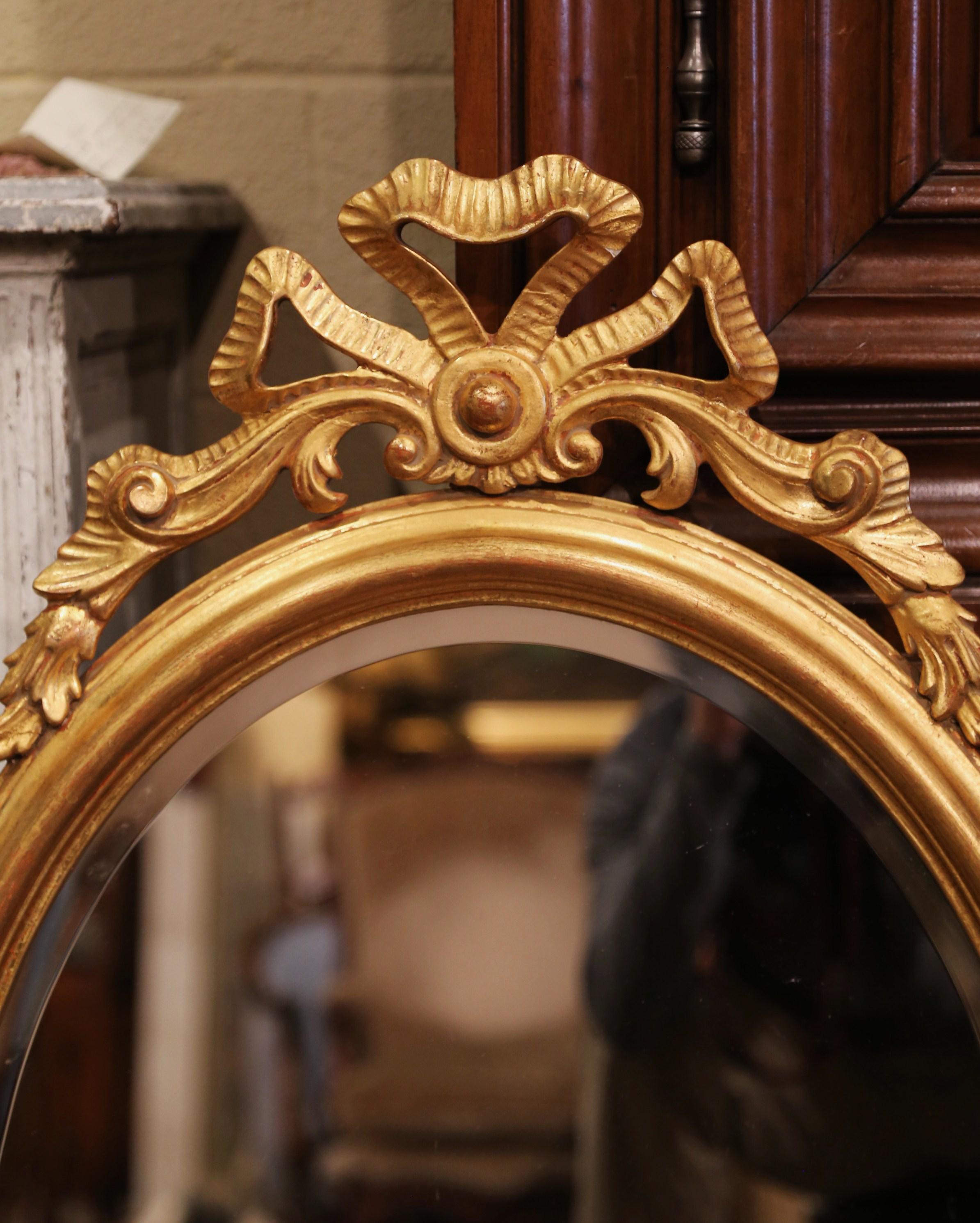Mid-Century French Louis XVI Carved Giltwood Oval Wall Mirror with Beveled Glass In Excellent Condition In Dallas, TX