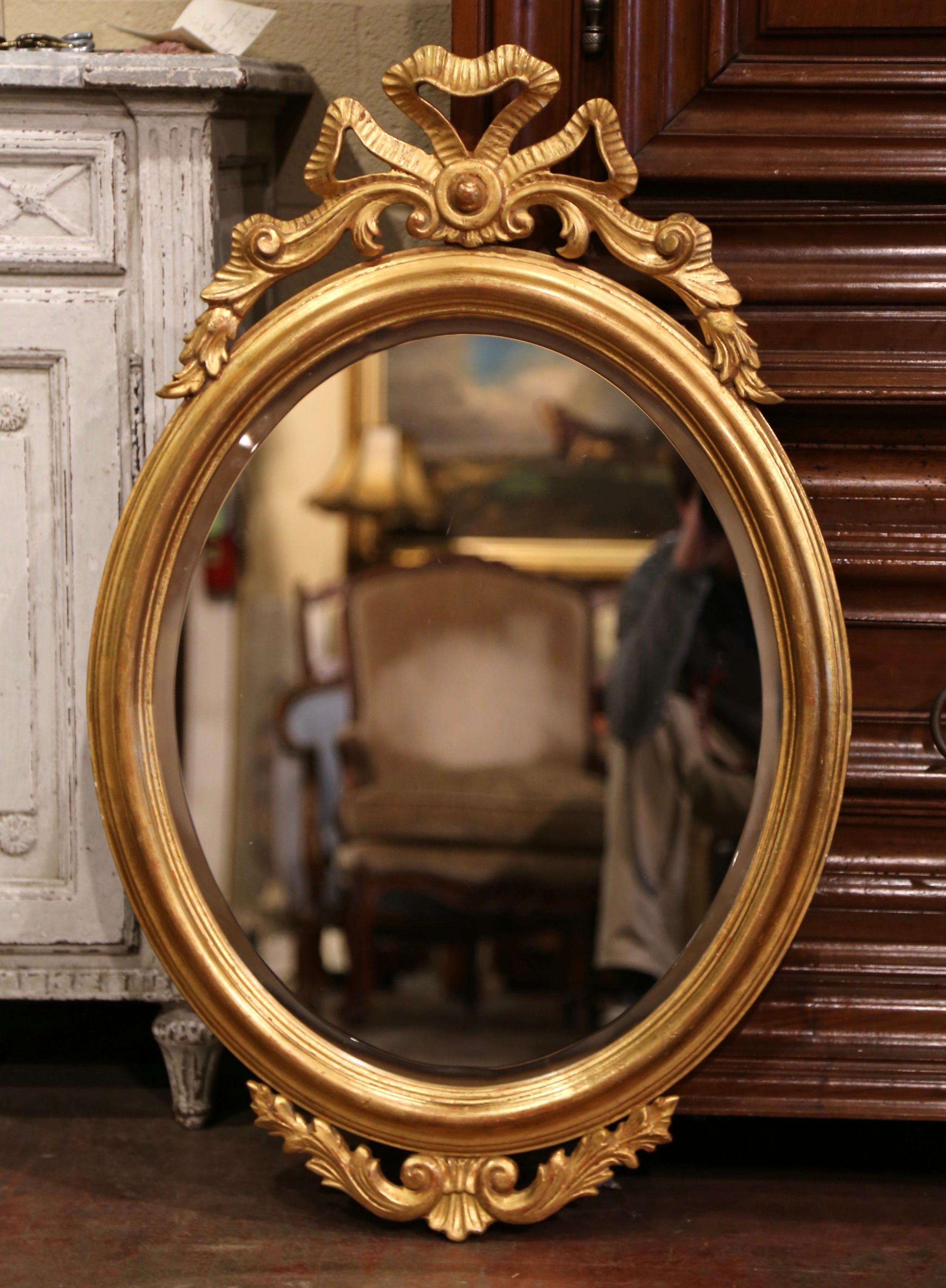 20th Century Mid-Century French Louis XVI Carved Giltwood Oval Wall Mirror with Beveled Glass