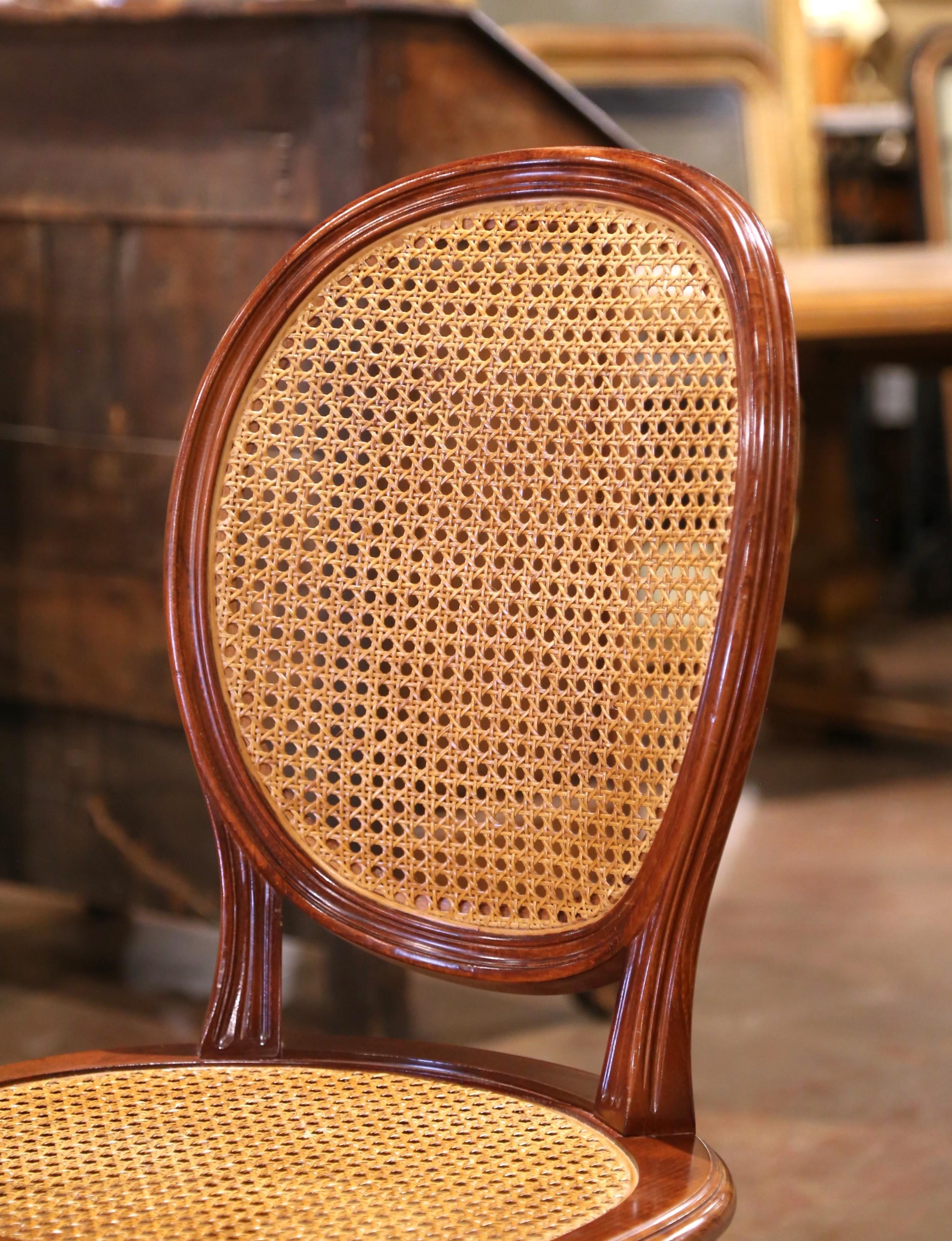 Sculpté à la main Mid-Century French Louis XVI Carved Walnut and Cane Dining Chairs, Set of Six en vente