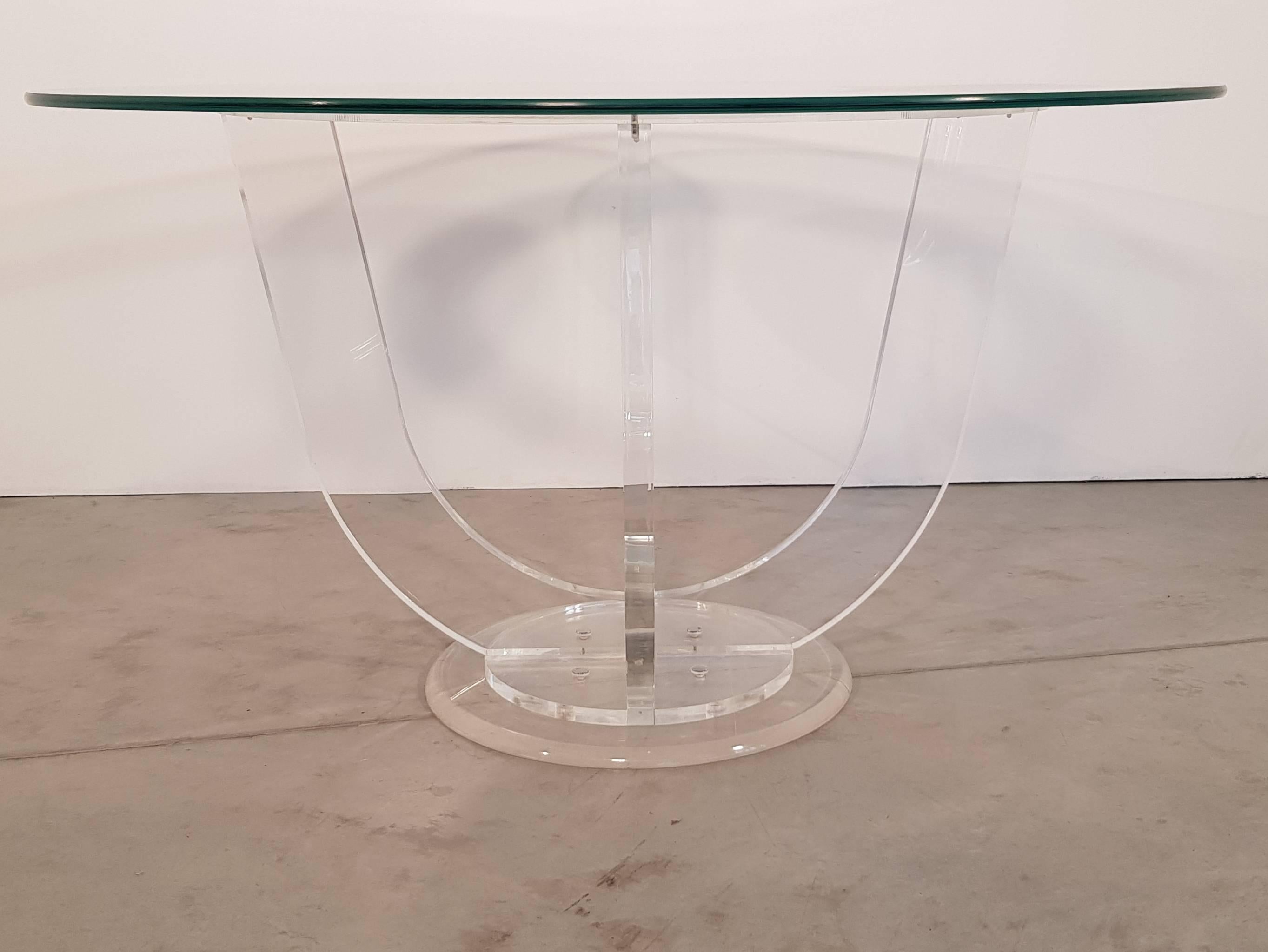Nice dining or center table made in plexiglass with glass top from France, 1960s.