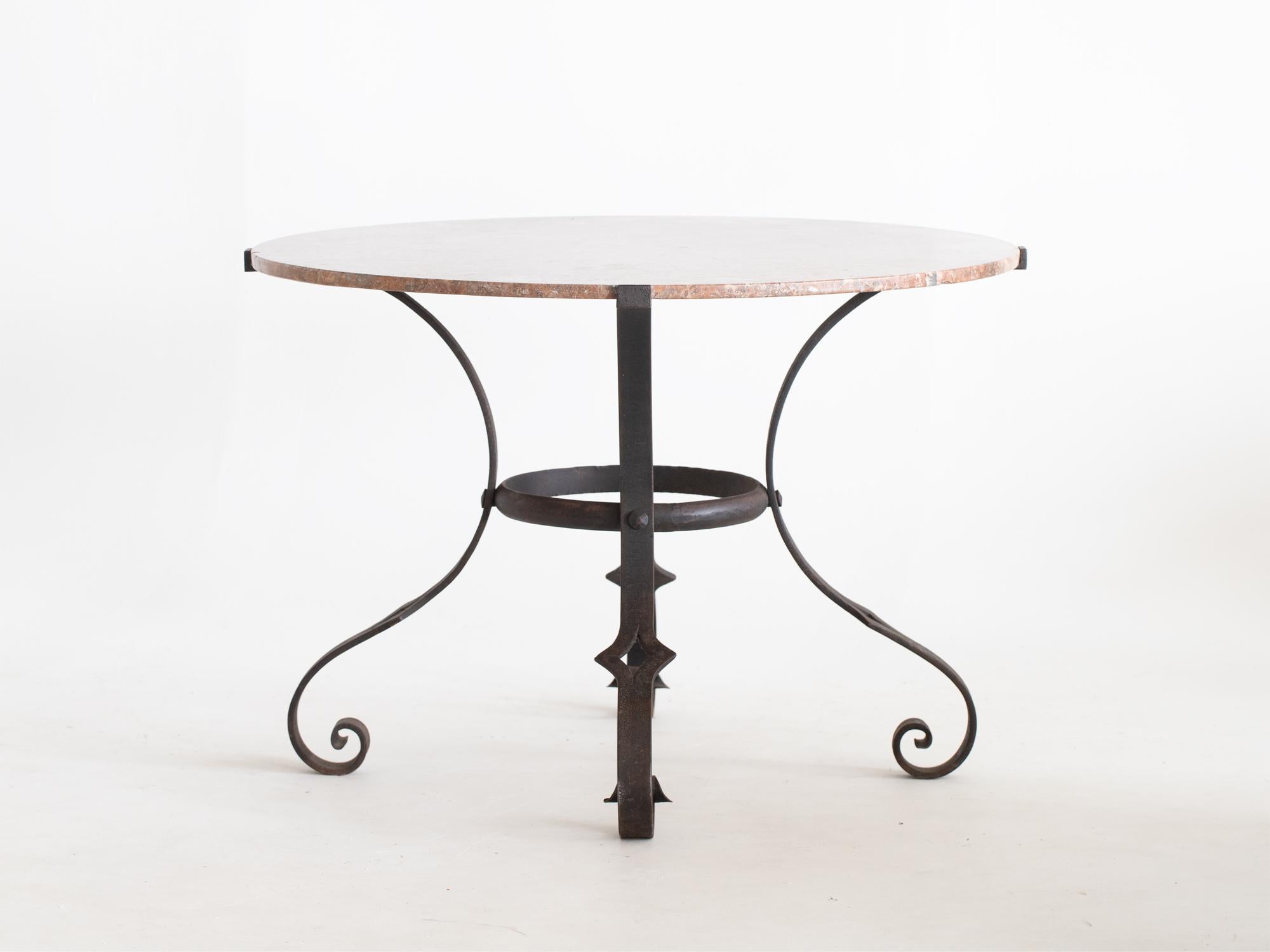 A circular red marble and wrought iron centre or dining table. French, c. 1950s.

Stock ref. #2201

In good sturdy order. Small losses to the marble edge.

75 x 108 x 108 cm

29.5 x 42.5 x 42.5 