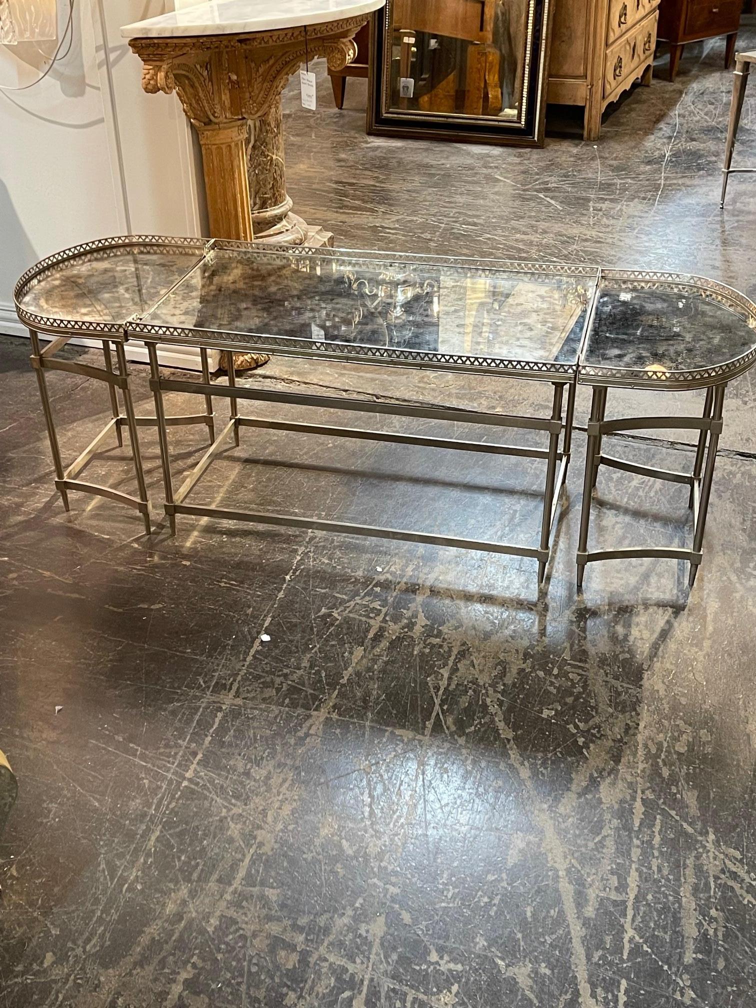 Mid-century French Bagues style steel coffee table with mirror top. Circa 1940. This table has nice clean lines and fits perfectly into any space.