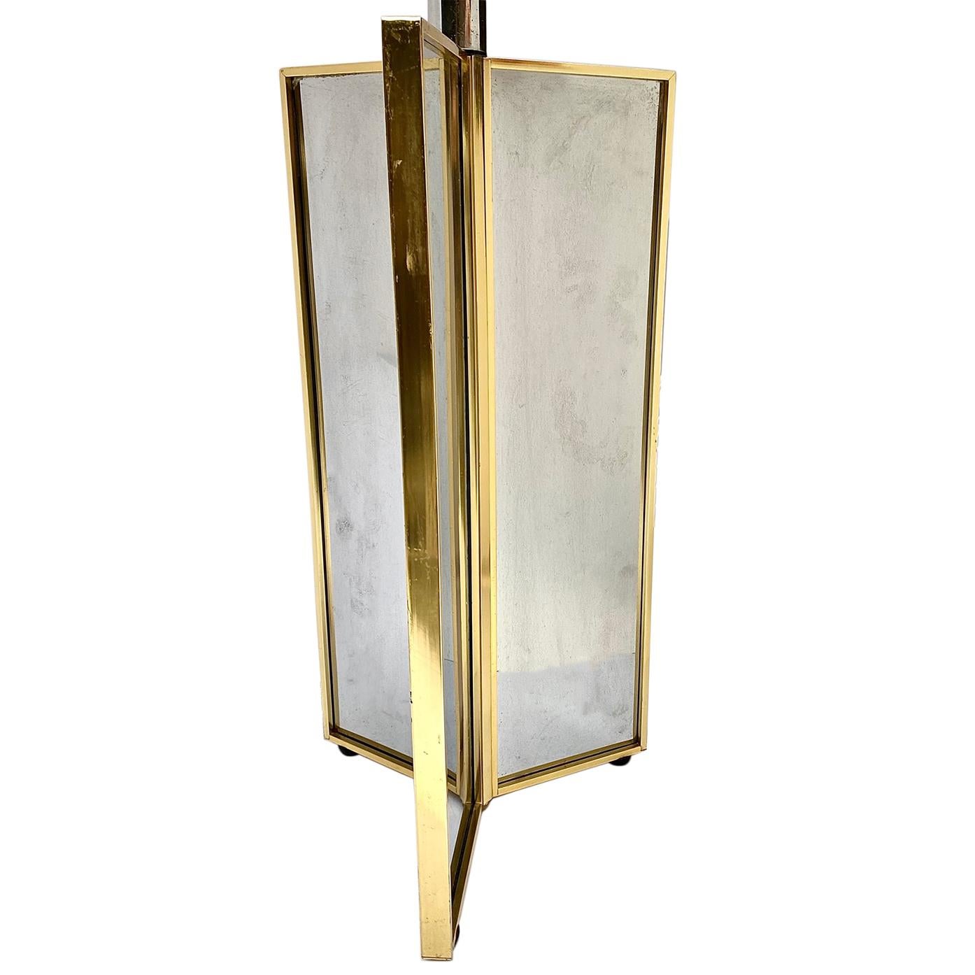 A single circa 1970's French mirrored table lamp with brass details.

Measurements:
Height of body: 19