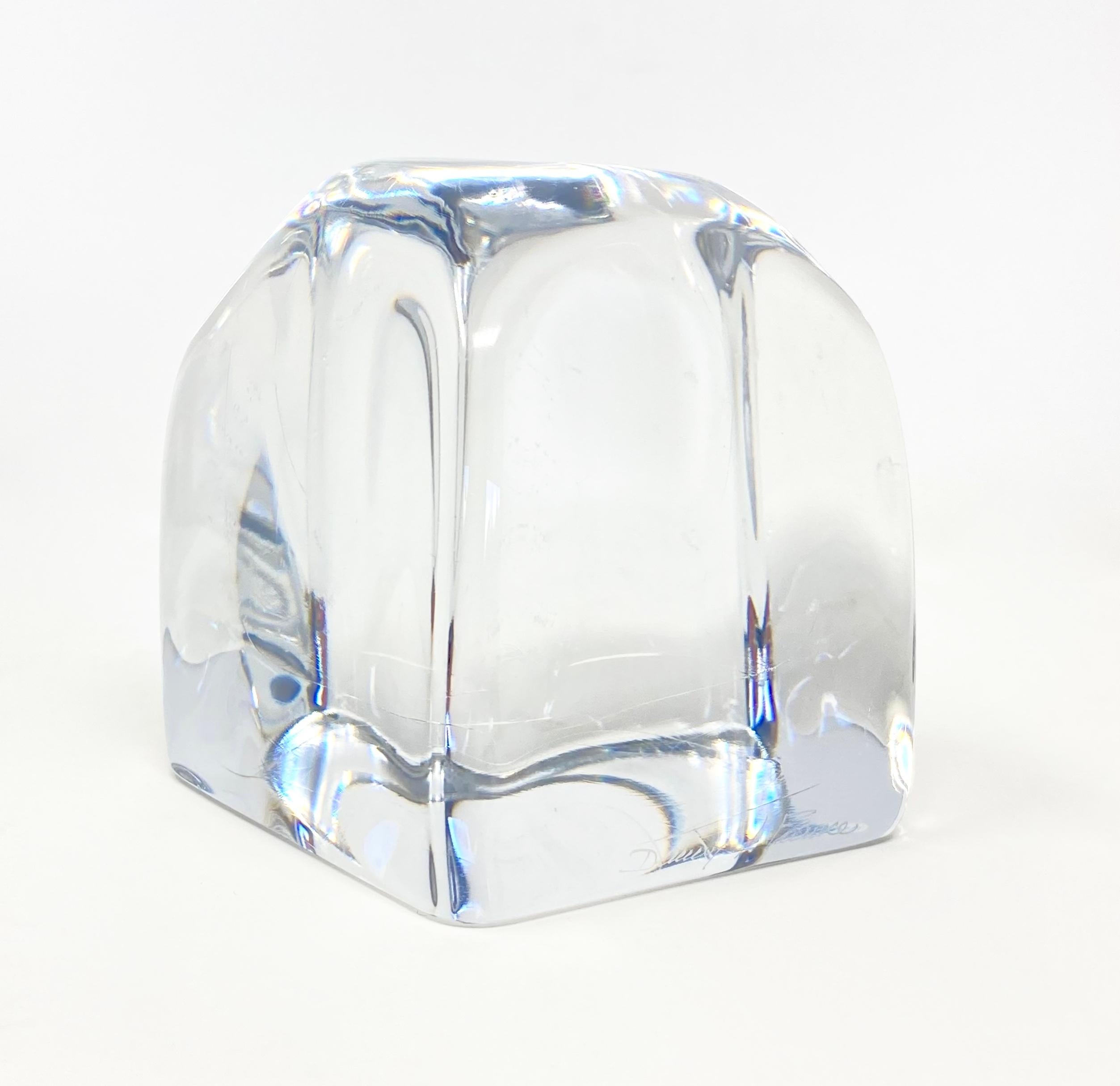 A magnificent, crystal desktop paperweight by renowned French crystal maker Daum. This is a unique, hand-made piece in transparent crystal, engraved on the bottom edge with the recognizable acid-etched 