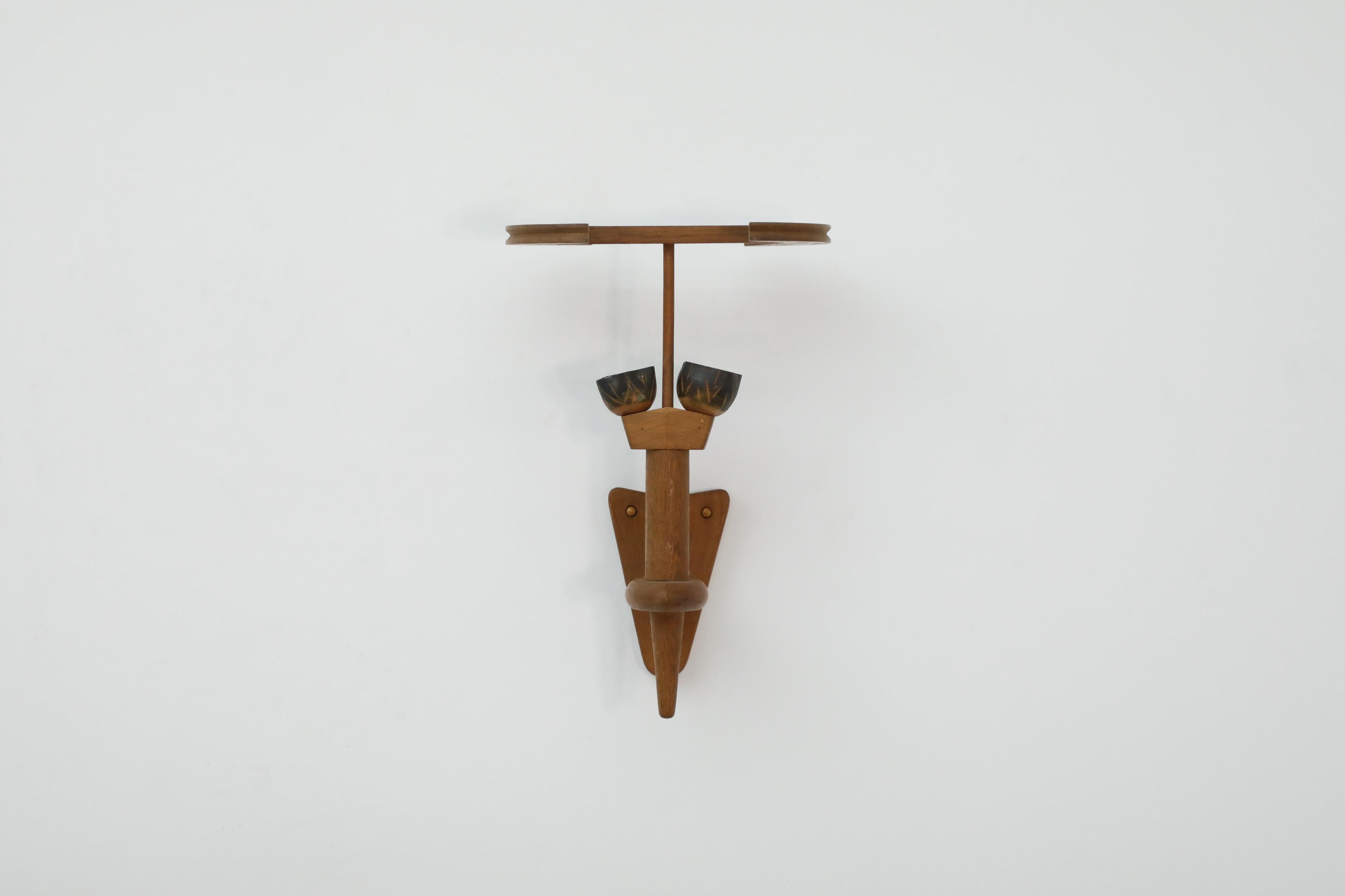 Mid-Century oak and ceramic wall sconce by Guillerme et Chambron for Votre Maison. Unique French oak wall lamp that sits like a torch in it's holder. The ceramic cups that hold the original bayonet sockets have dark matte espresso color with an