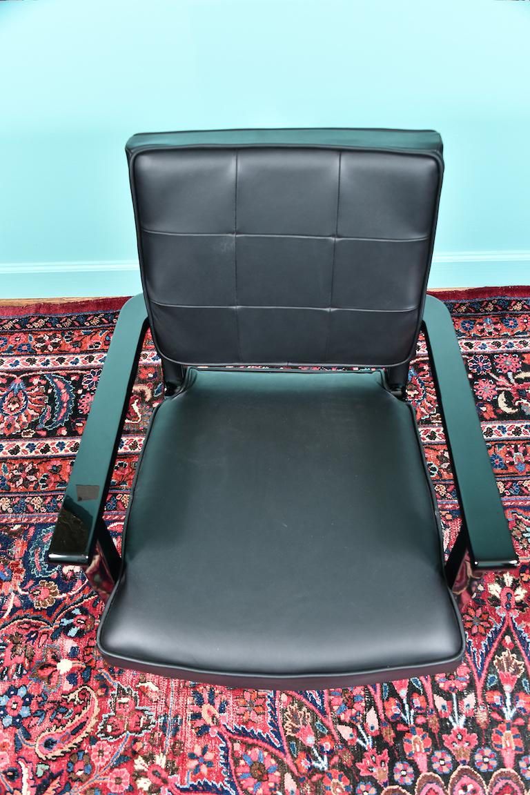 Chair is made out of ebonized white oakwood. Front legs are decorated with brass tips and the chair is re-upholstered with black cowhide.
Condition is perfect.
France, circa 1950s
Measures: 24” x 24” x 34” (chair).
  