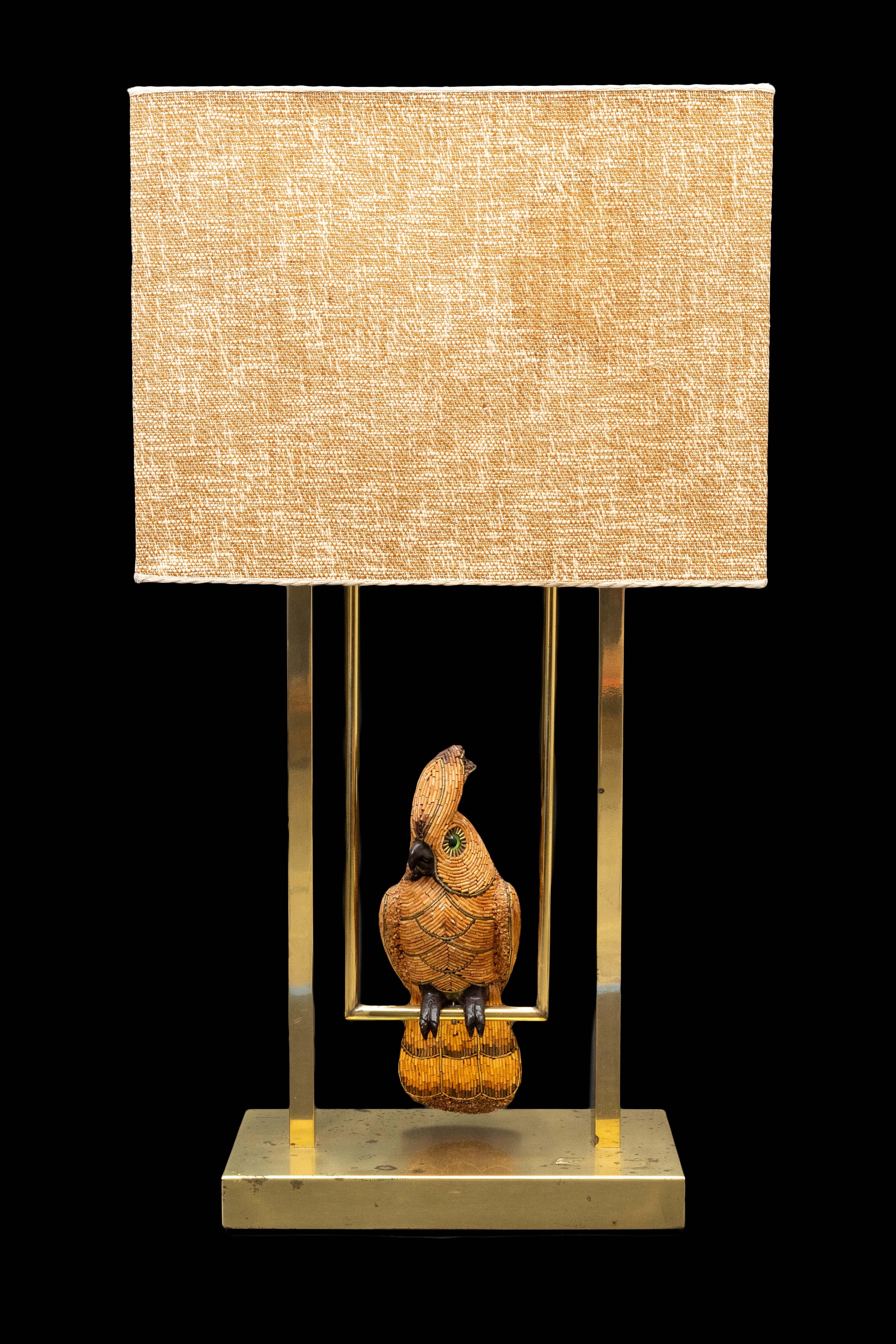 Mid Century French cockatoo lamp. Cockatoo is beaded and is mounted on a working swing. Original Mid Century linen shade:

Measures: 18