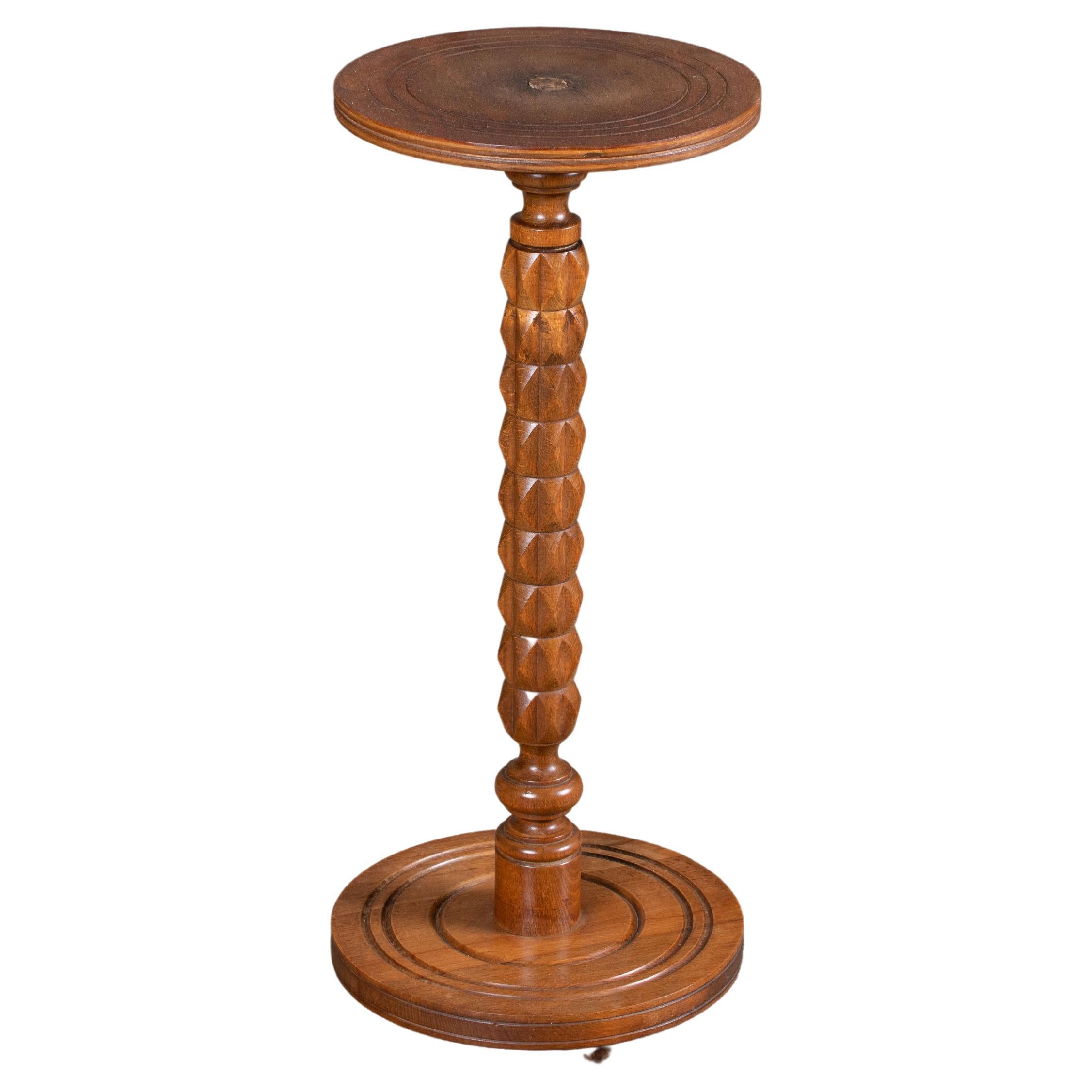 Beautiful carved wood pedestal attributed to Charles Dudouyt, made in France, 1940's. Dark wood finish with circular top and four leg base.
A major figure in early 20th-century French design, Charles Dudouyt moved France’s design aesthetic from an