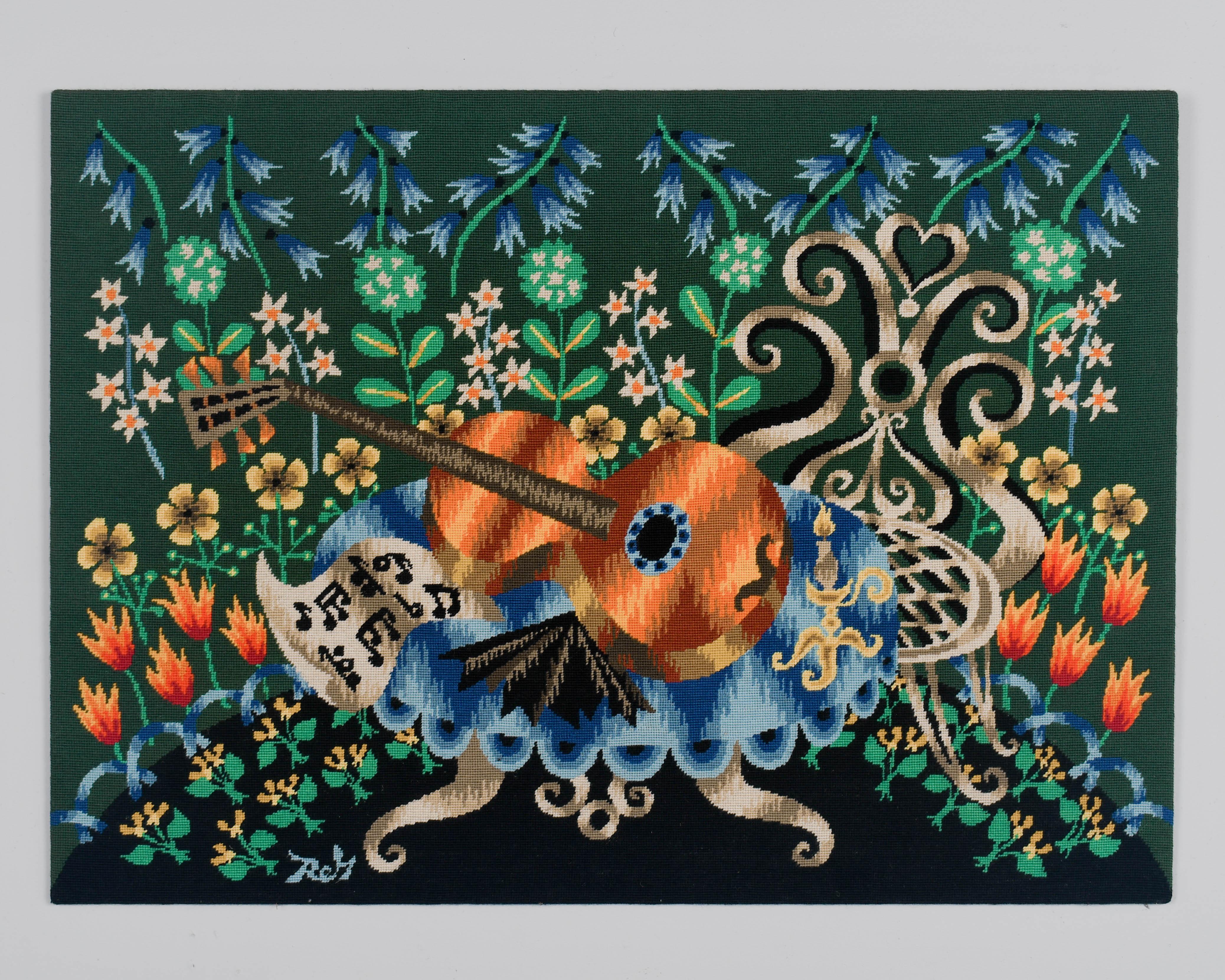 A French Mid Century decorative petit point wool tapestry depicting still life with guitar surrounded by colorful flowers in a garden setting. Vivid color, in shades of orange, yellow and blue on green ground. In the style of Jean Picart Le Doux. 