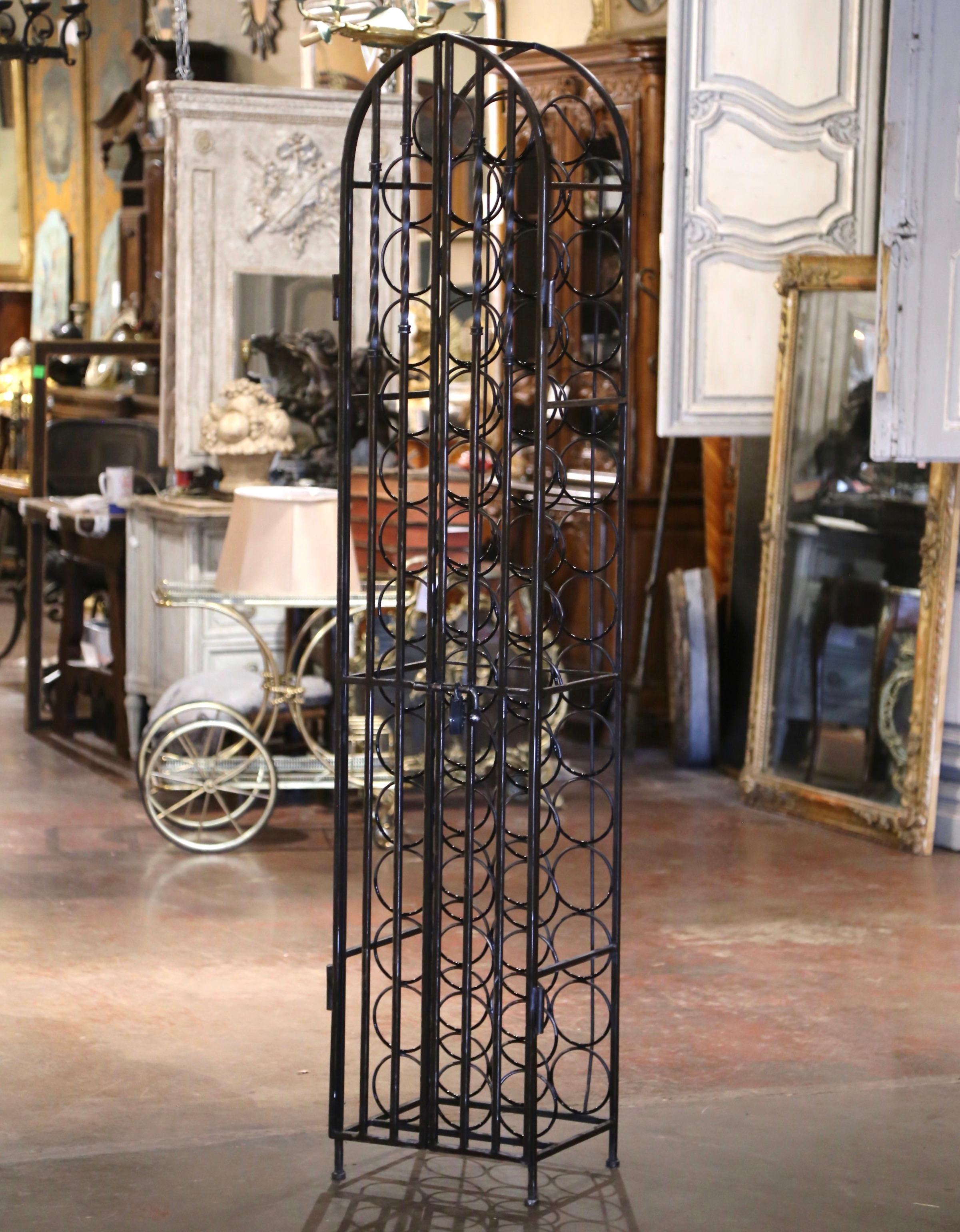 Decorate a wine cellar with this exquisite antique wine storage cabinet with wall mounted brackets. Forged in the Burgundy region of France and rectangular in shape with arched top, the open cage built of forged iron, features twi hinged hinged door
