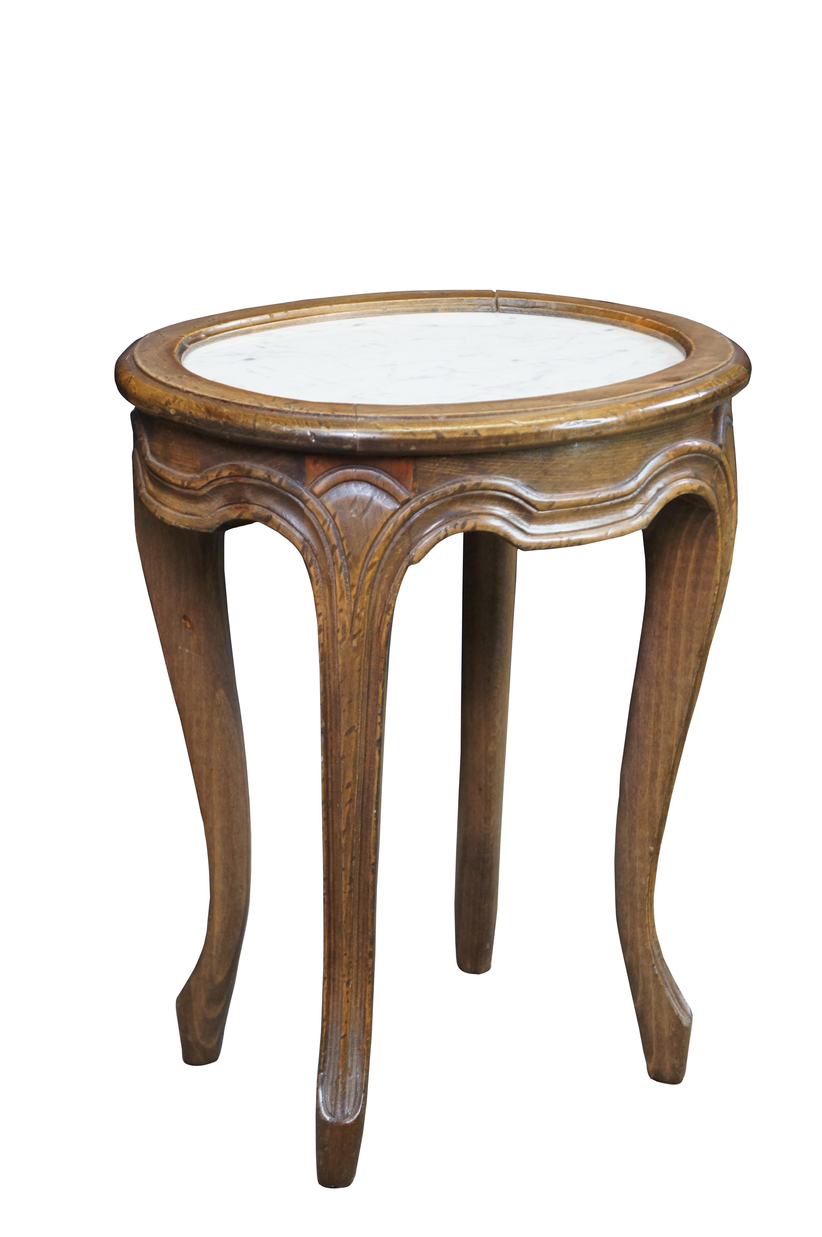 Mid century, circa 1940s, French country side table or plant stand.  Made of walnut featuring a white marble top with serpentine accents and cabriole legs.


Dimensions:
14