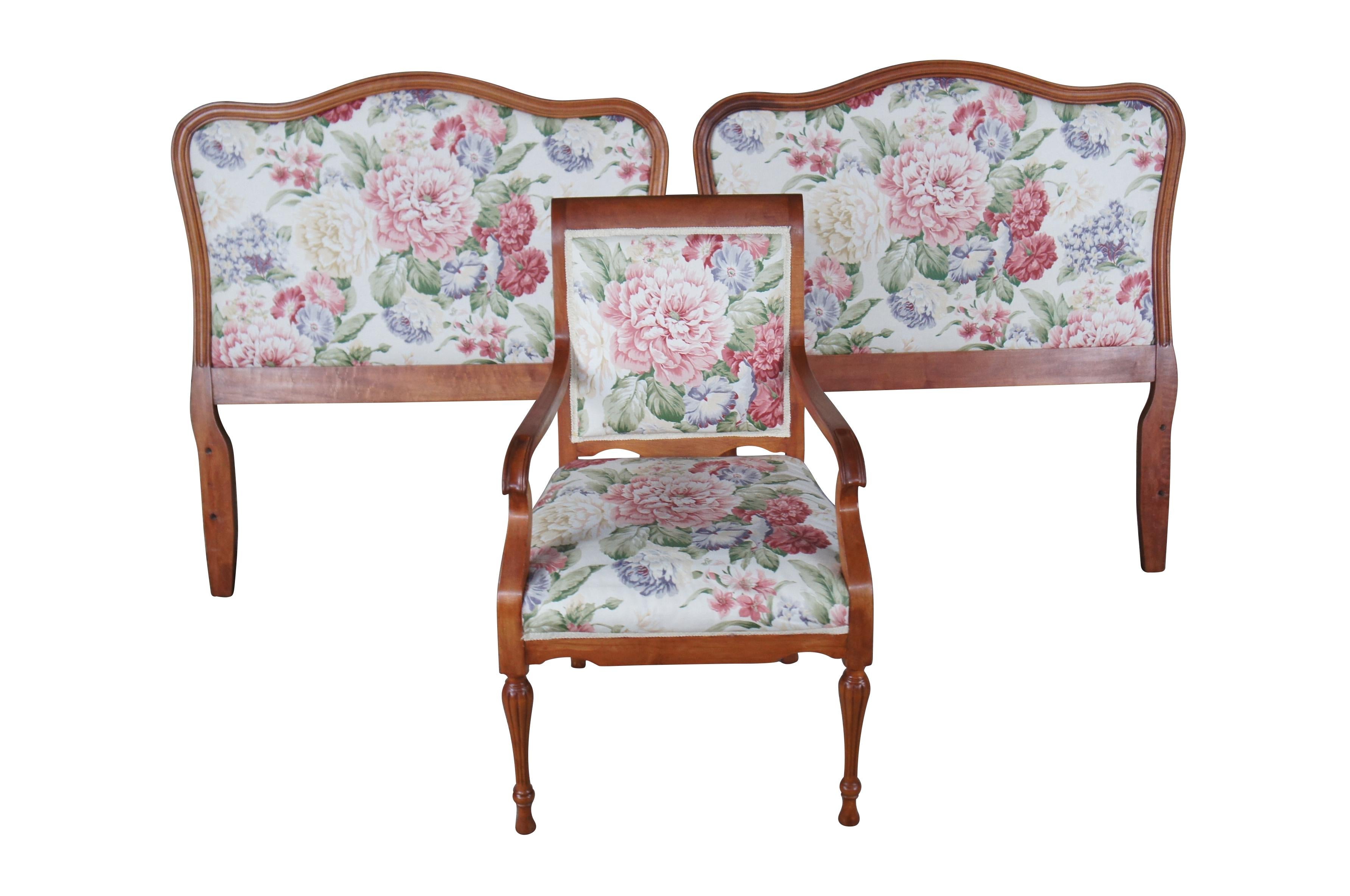 A vintage pair of twin beds and matching arm chair.  Made from mahogany with floral upholstery.  The two beds  camelback design.  The armchair has sloped arms and is supported by fluted and turned legs.

Dimensions:
headboards 38.5