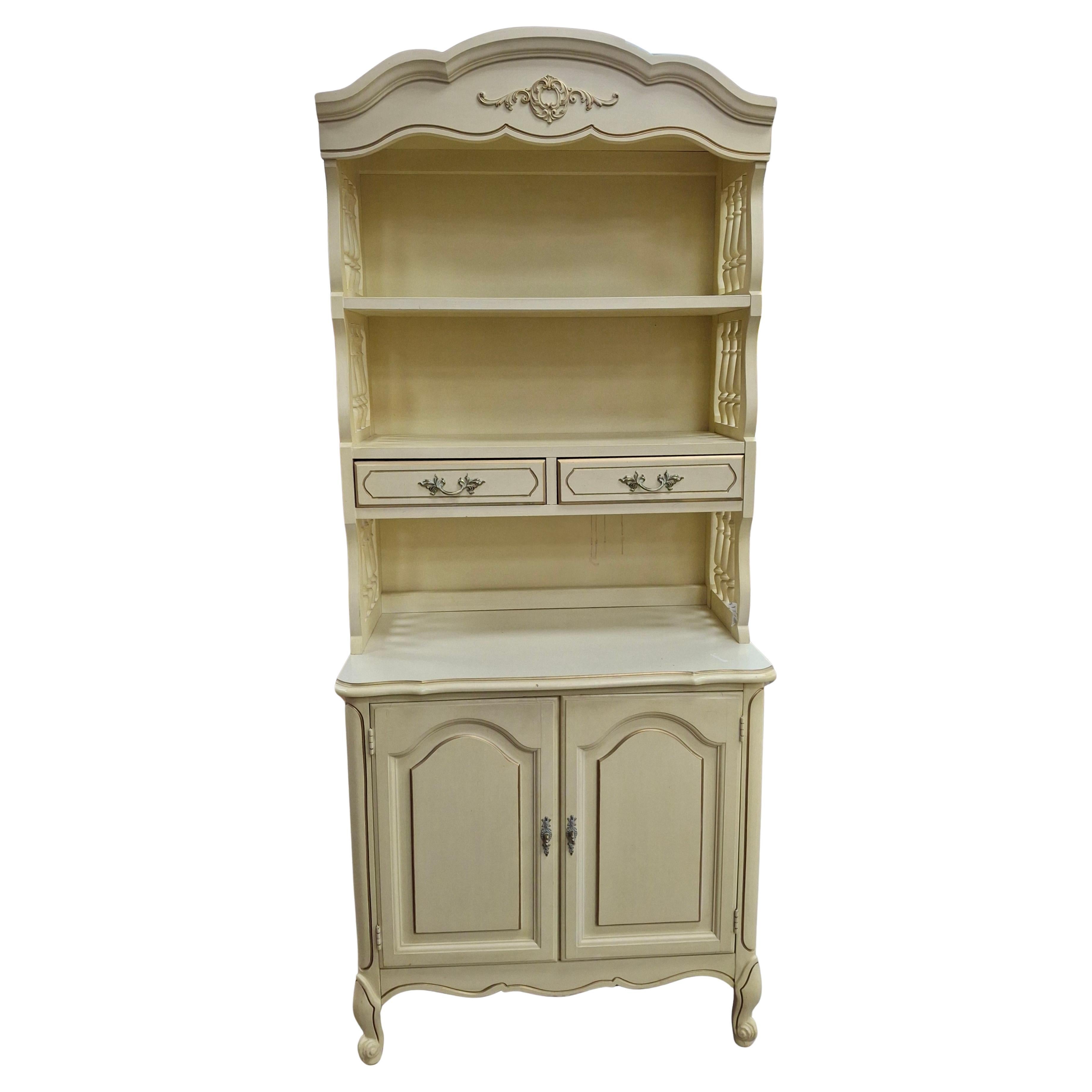 Mid Century French Provincial Style Cream Painted 
Partial Gilt 2-Part Bookcase For Sale