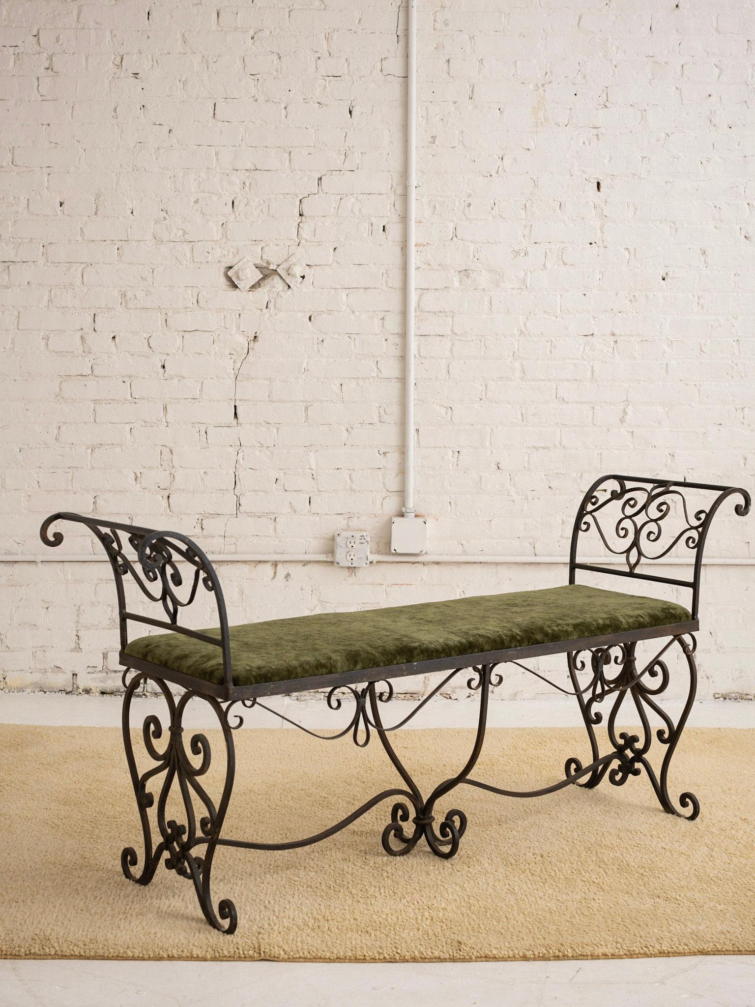 Mid Century wrought iron bench. French Provincial style silhouette. Original patinaed gold finish.