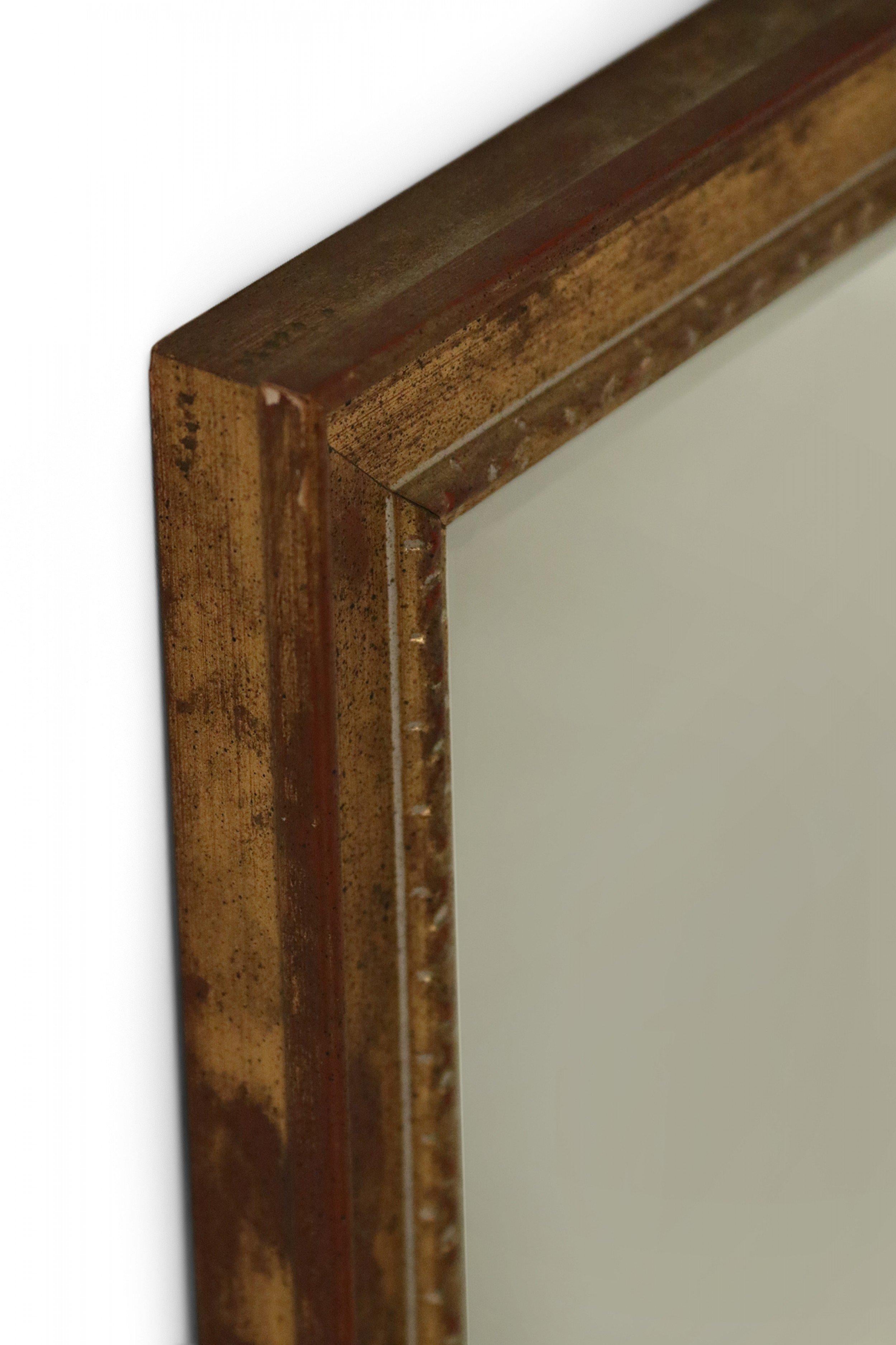 French (late 20th Century) rectangular wall mirror with a simple giltwood frame.