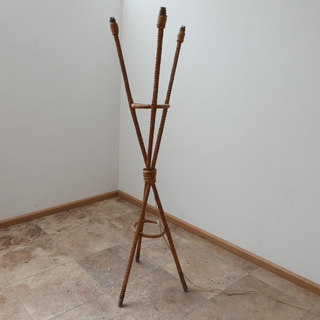 A scarce floor lamp by Audoux-Minet. 

France, c1960s. 

Rope work typical of their work. 

Three arms and legs. 

Some dirt and wear to the legs commensurate with age. 

Dimensions: 146 H x 40 D x 40 W in cm. 

Delivery: POA.

   