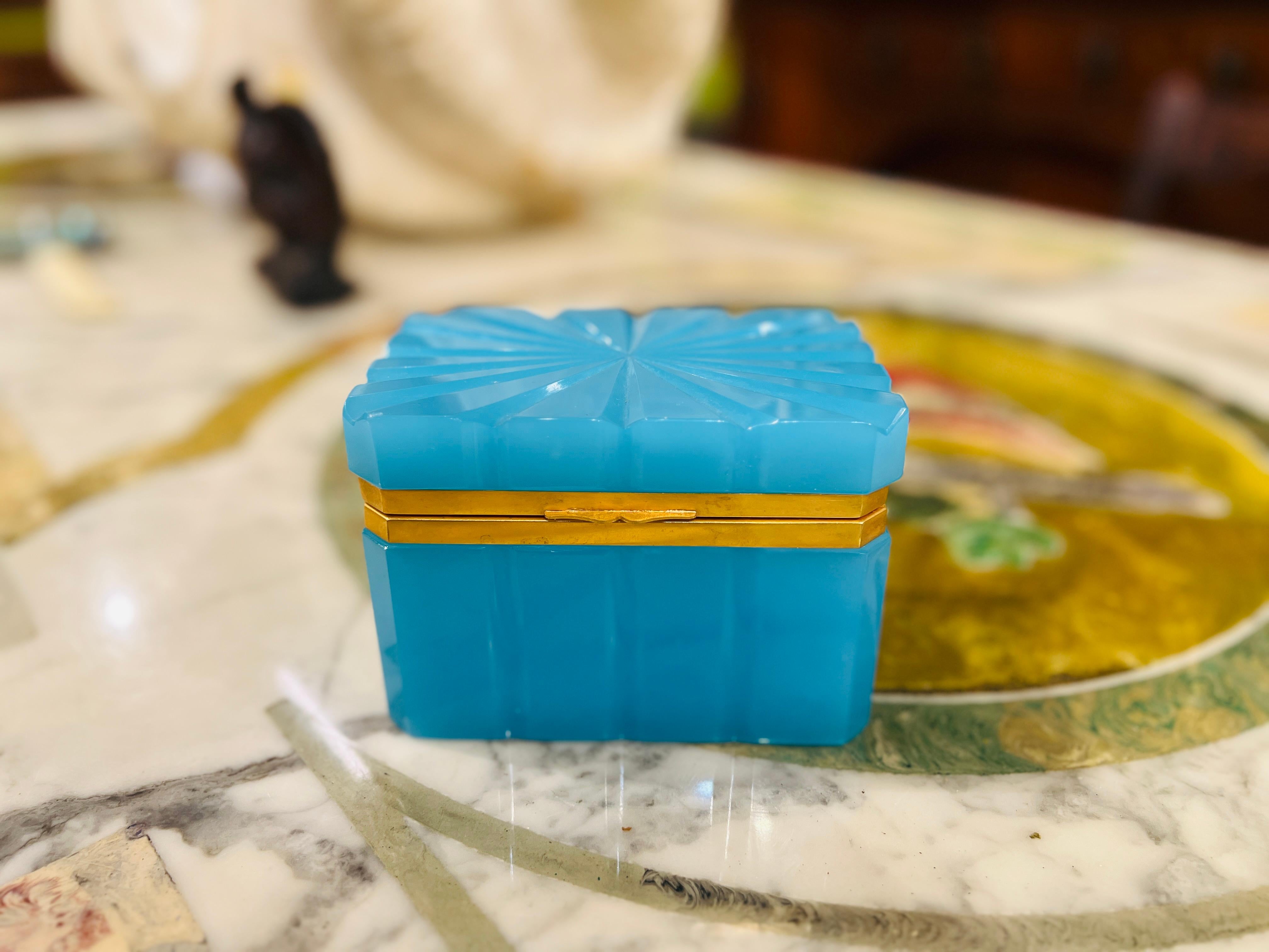 French, mid 20th century.

Beautiful blue opaline box with sculpted exterior, bronze dore mount and strong hinge. 

Unmarked and in excellent condition. 

Measures: 5.25