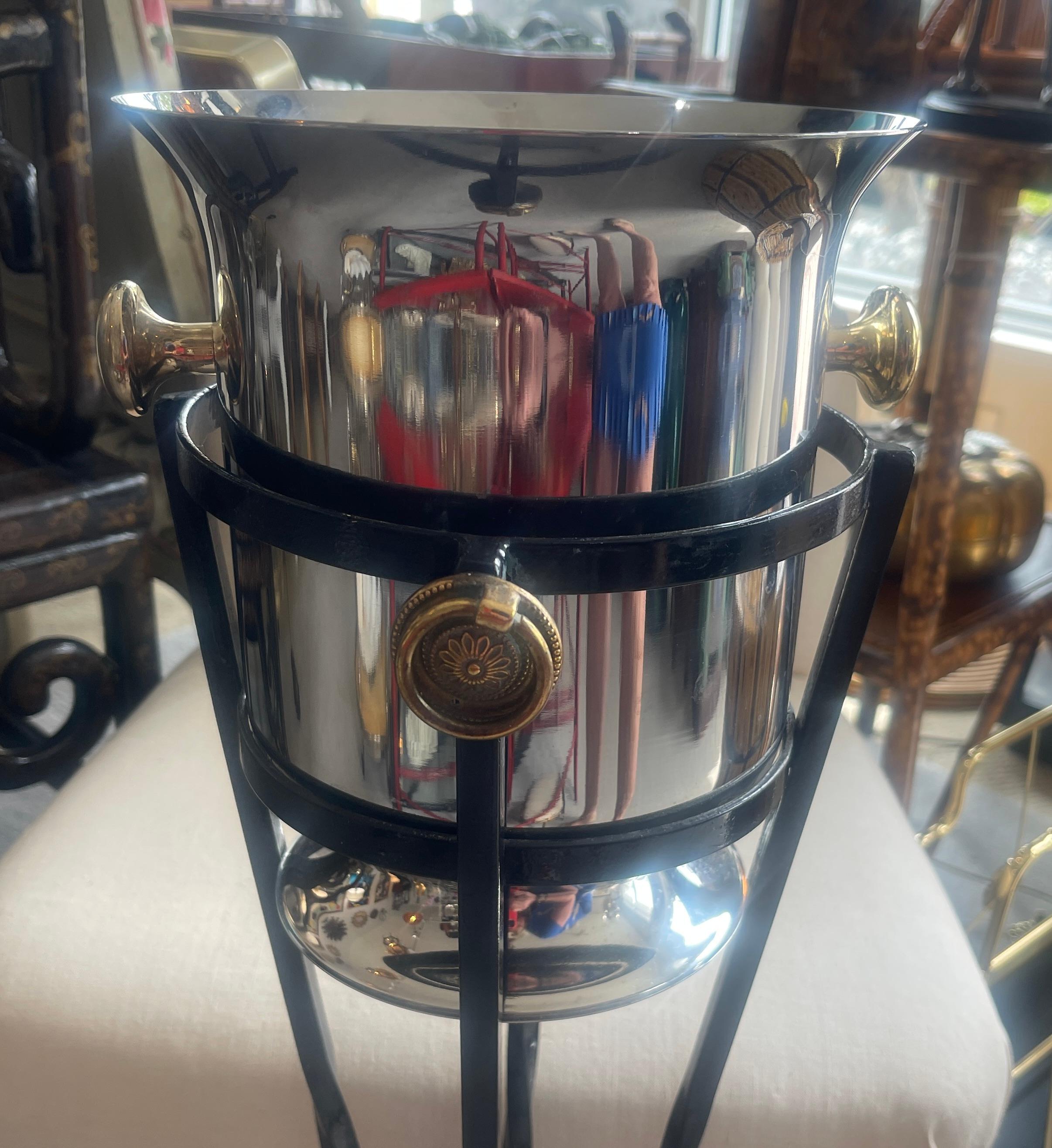 Just in, this Mid-Century French Standing Ice Bucket Holder & Ice Bucket.
The stand is Black painted metal with a Red Accents,  the Ring ,and the tip of the stand.
Dimensions of the stand is 26.5
