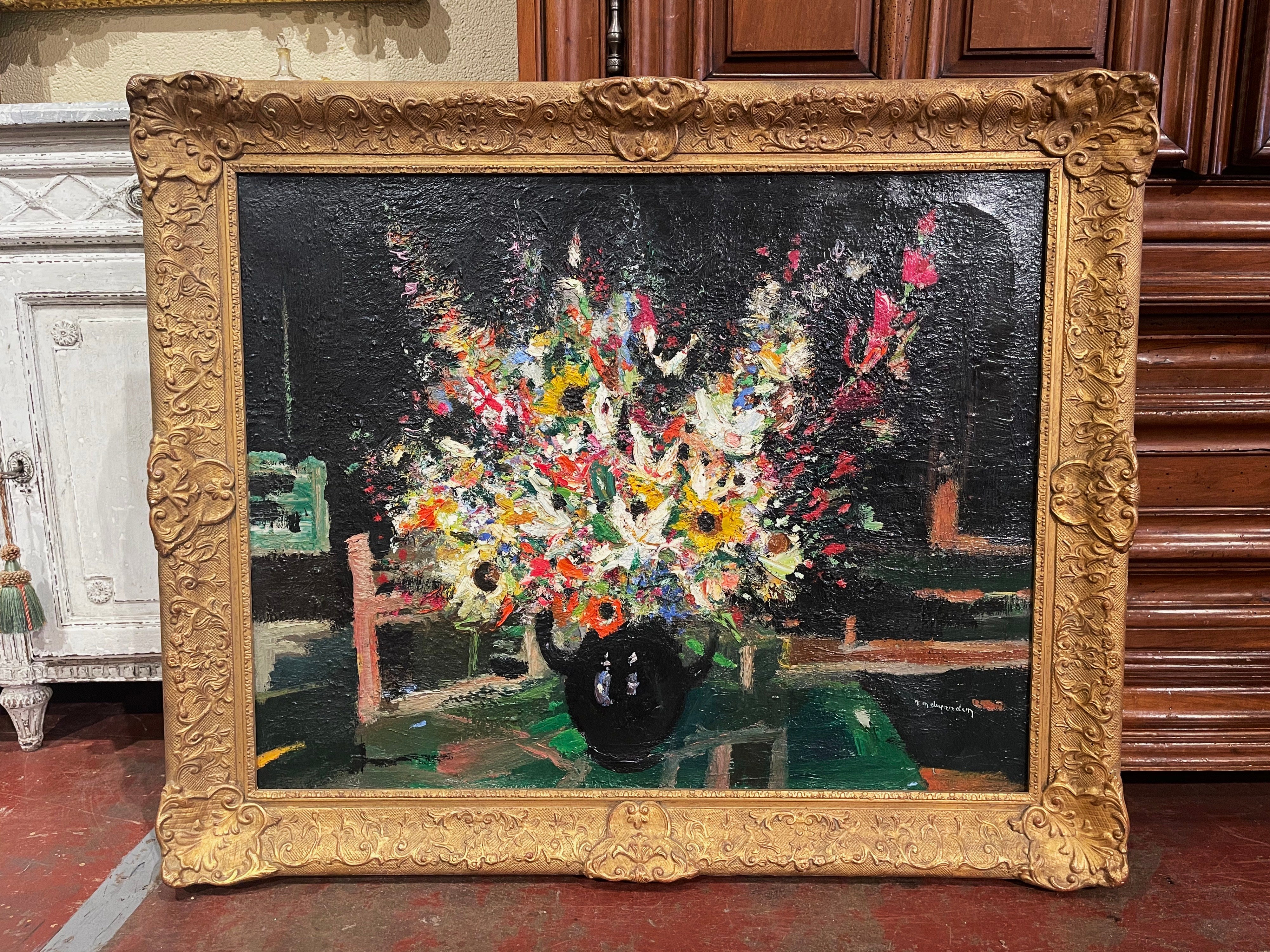 Invite color and life into your home with this large antique still life painting on canvas. Set in the original carved gilt wood frame, and signed by the artist 