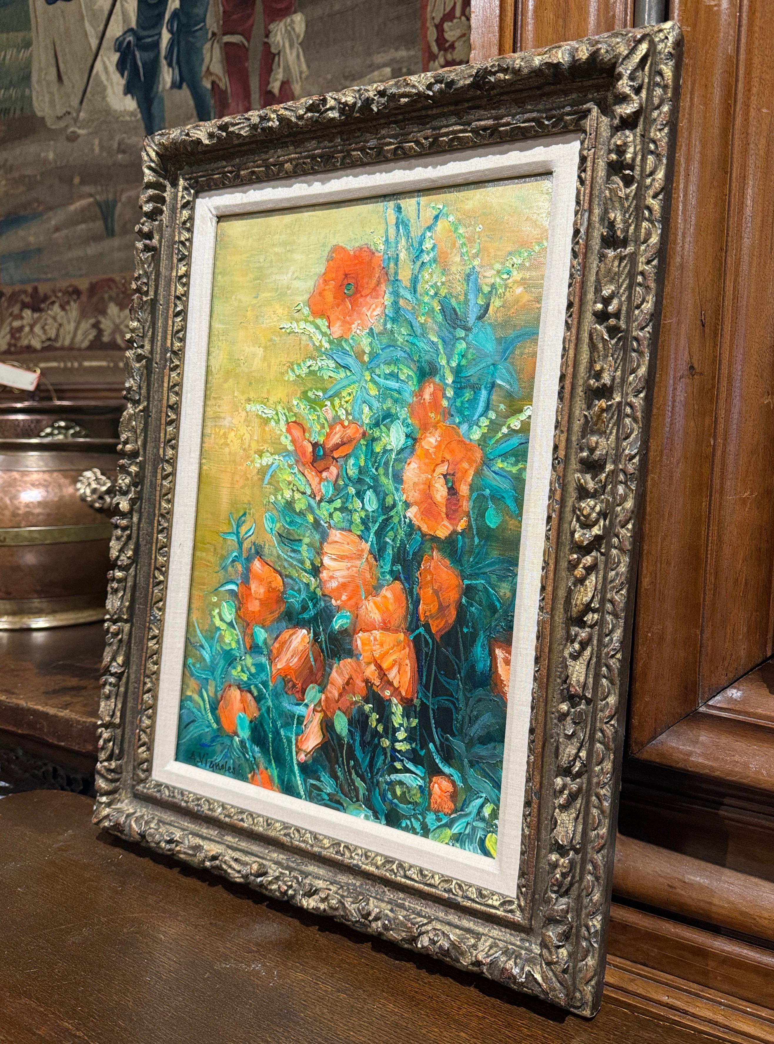 Decorate a wall with this colorful antique painting. Created in France, circa 1960 and signed in the lower right corner by French artist, Andre Vignoles, the oil on canvas is framed in an ornate, dark gilt wood frame with elaborate carvings, adding